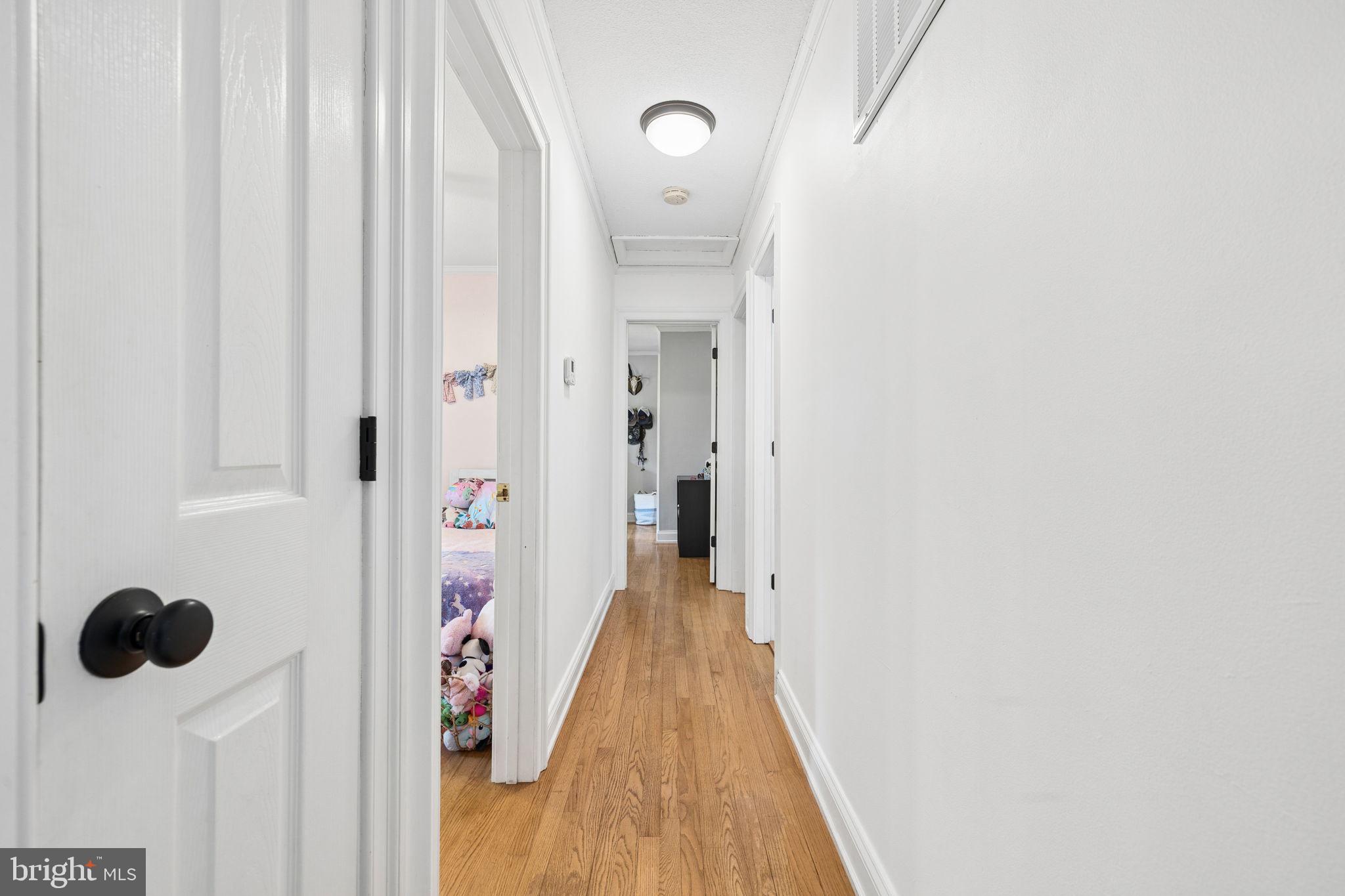 12237 Randle Lane Culpeper, VA 22701 - Photo 18 of 31 a view of a hallway with wooden floor and closet