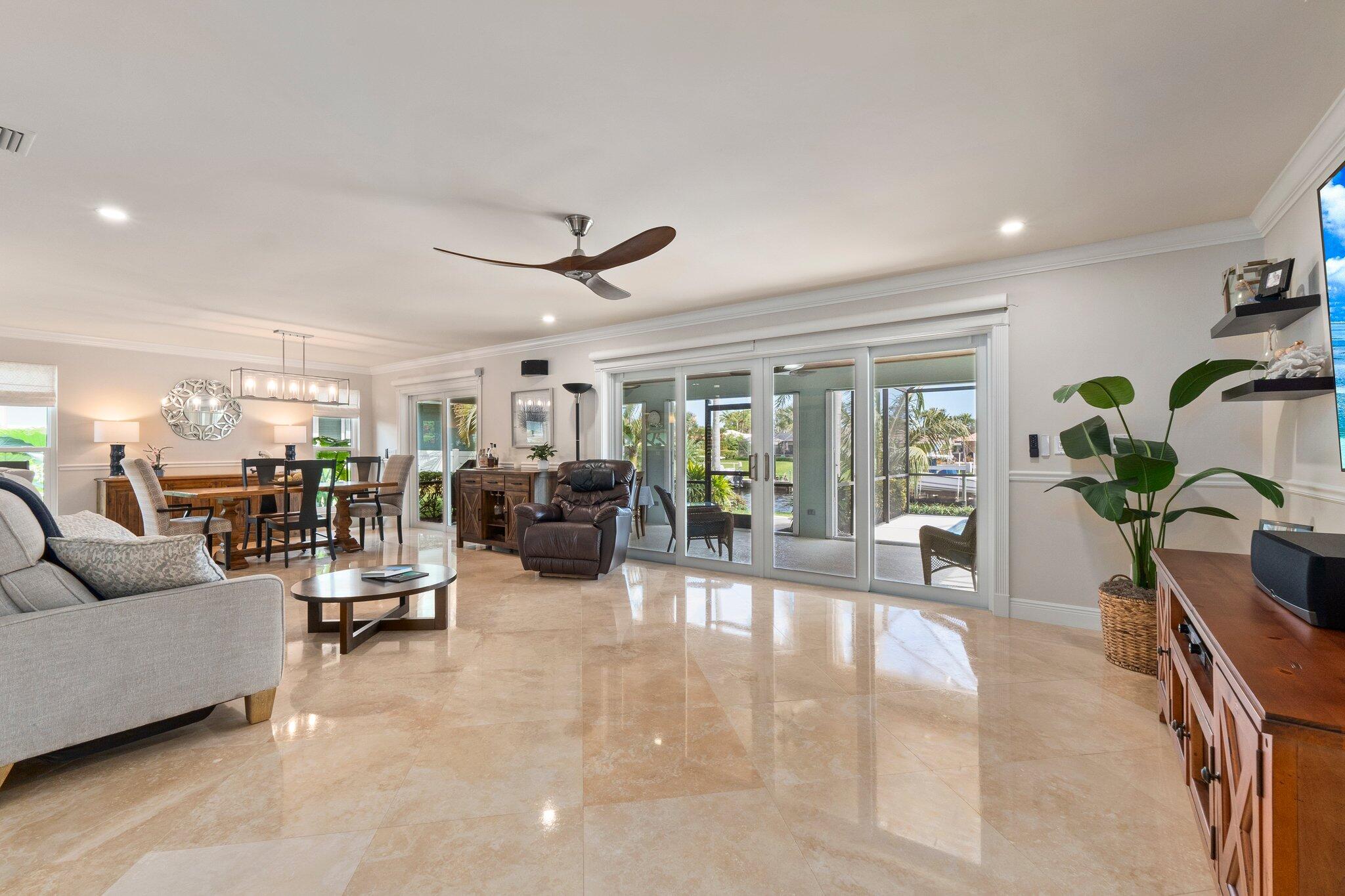 3142 Southeast Fairway West Stuart, FL 34997 - Photo 13 of 38 a living room with furniture and a large window