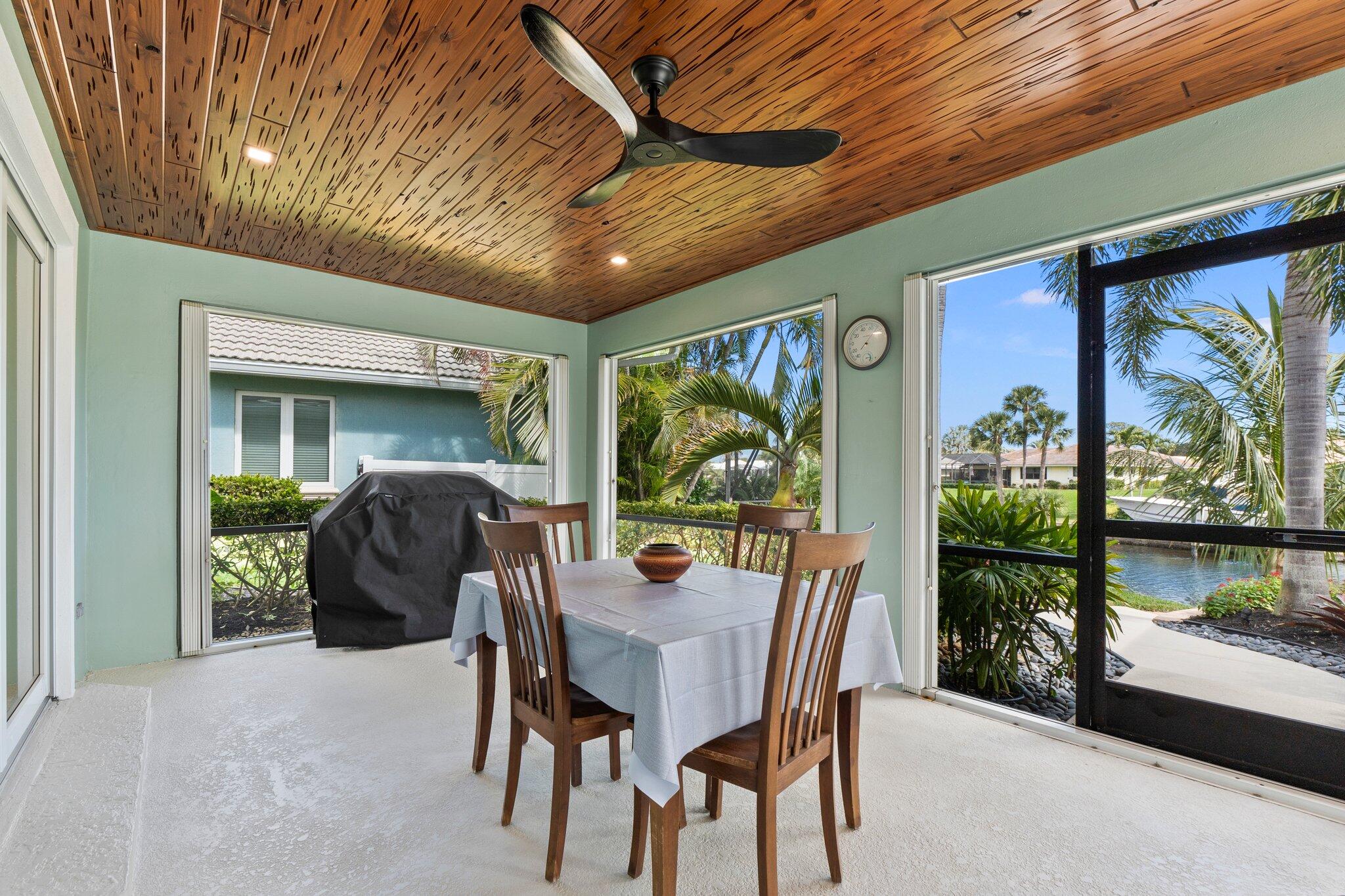 3142 Southeast Fairway West Stuart, FL 34997 - Photo 16 of 38 a view of a porch with furniture and yard
