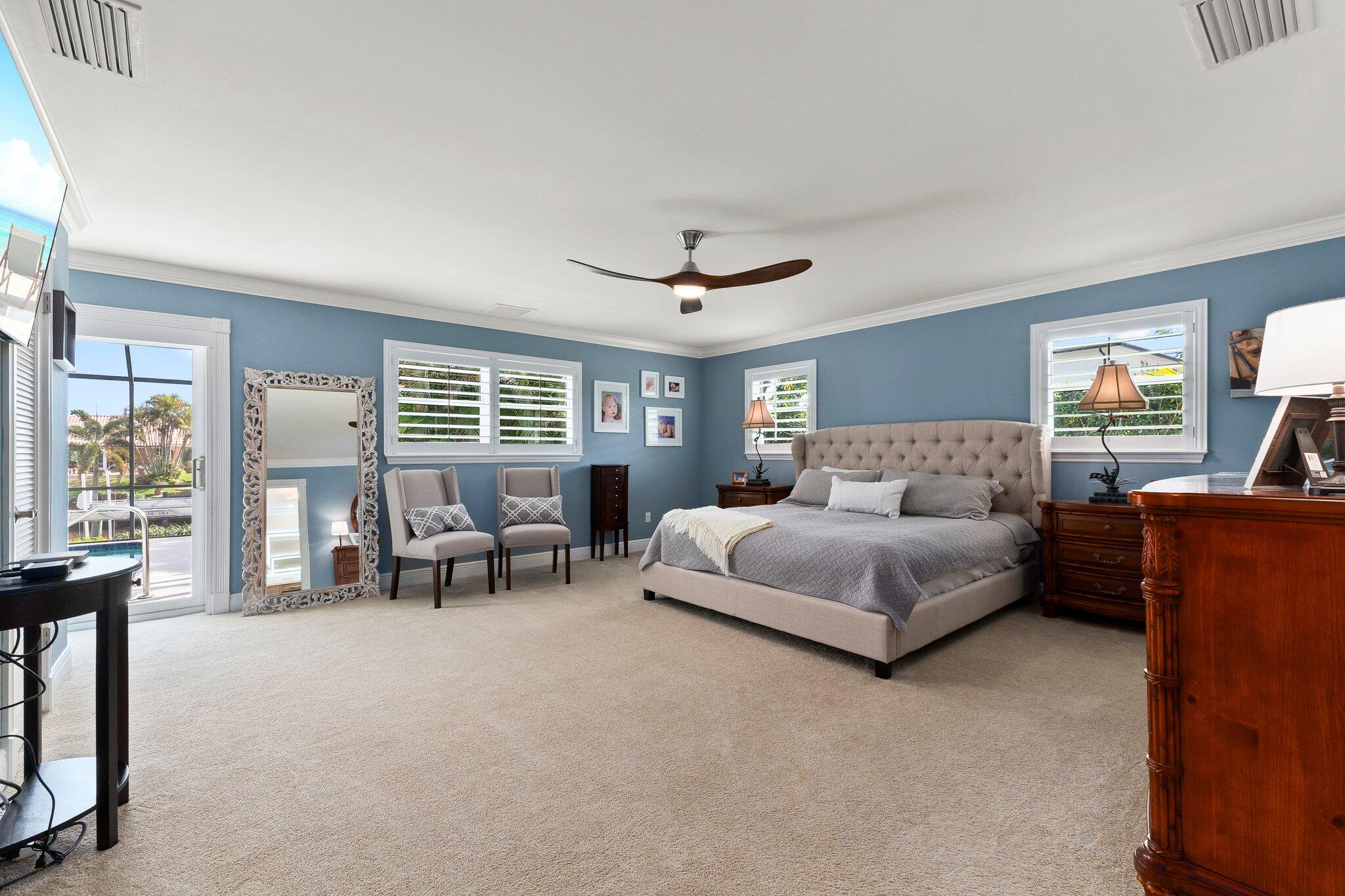 3142 Southeast Fairway West Stuart, FL 34997 - Photo 17 of 38 a living room with furniture and large windows