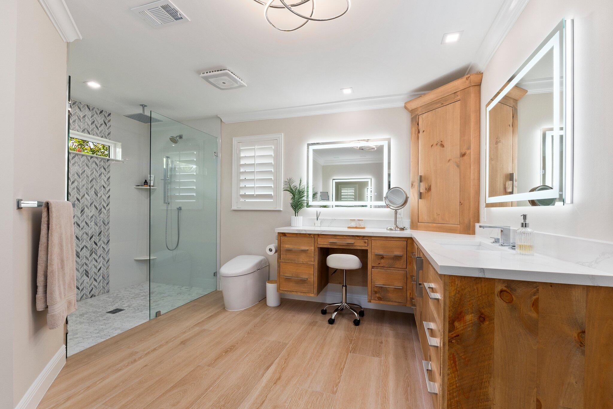 3142 Southeast Fairway West Stuart, FL 34997 - Photo 18 of 38 a bathroom with a toilet a sink and a mirror