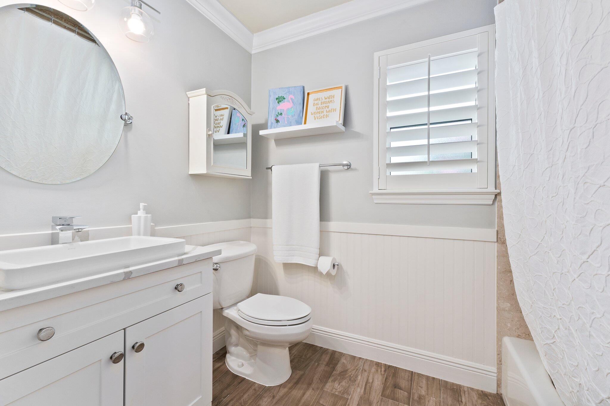 3142 Southeast Fairway West Stuart, FL 34997 - Photo 24 of 38 a bathroom with a toilet sink and mirror