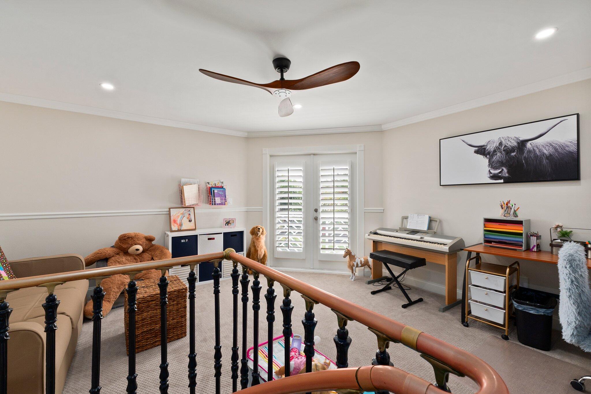 3142 Southeast Fairway West Stuart, FL 34997 - Photo 25 of 38 a view of a livingroom with workspace and windows