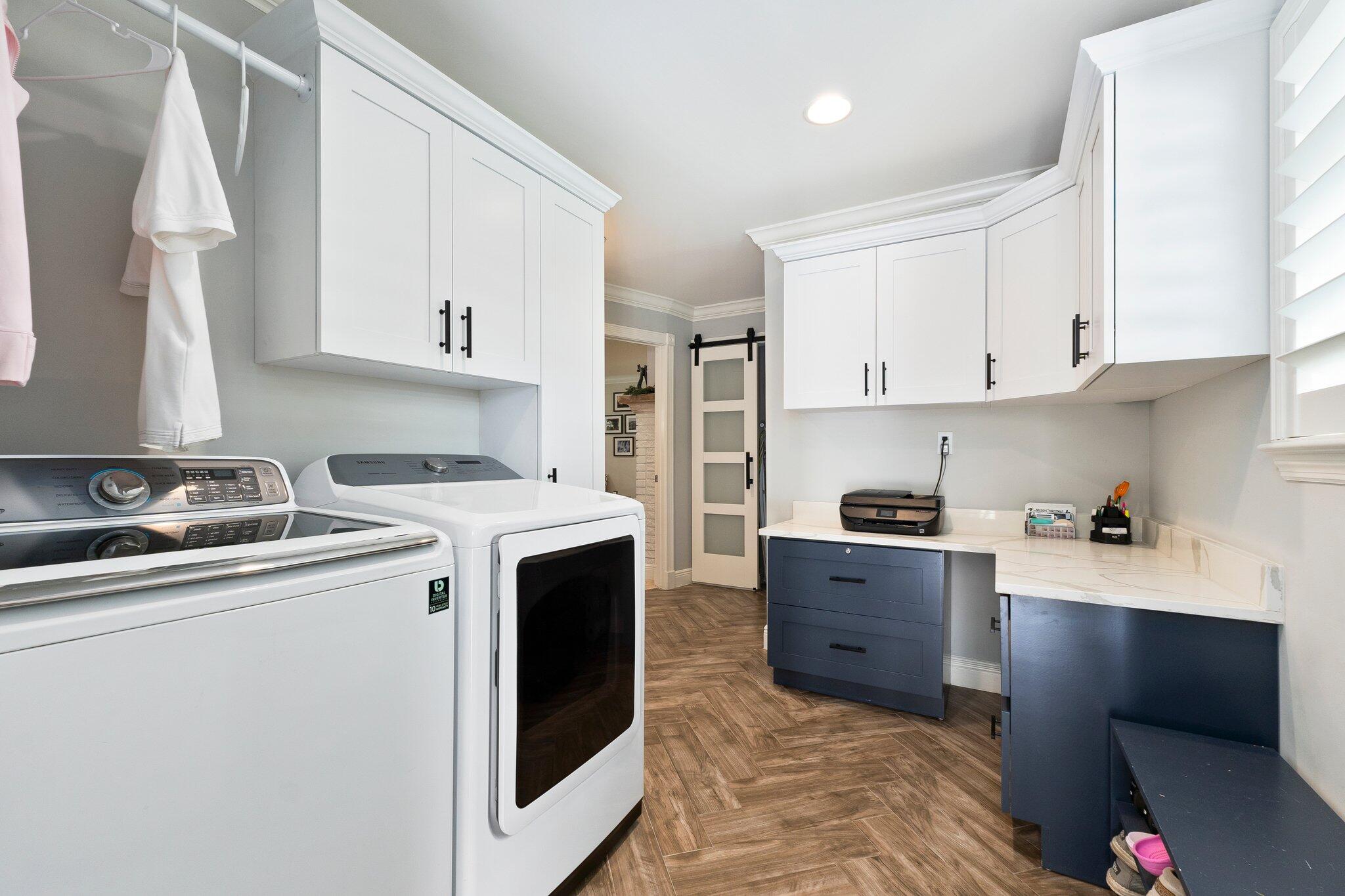 3142 Southeast Fairway West Stuart, FL 34997 - Photo 27 of 38 a kitchen with stainless steel appliances granite countertop a sink stove and refrigerator