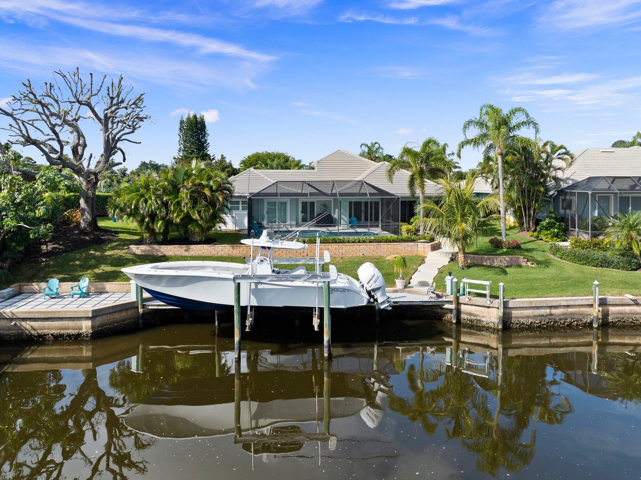 3142 Southeast Fairway West Stuart, FL 34997 - Photo 29 of 38 a view of swimming pool with outdoor seating and lake view