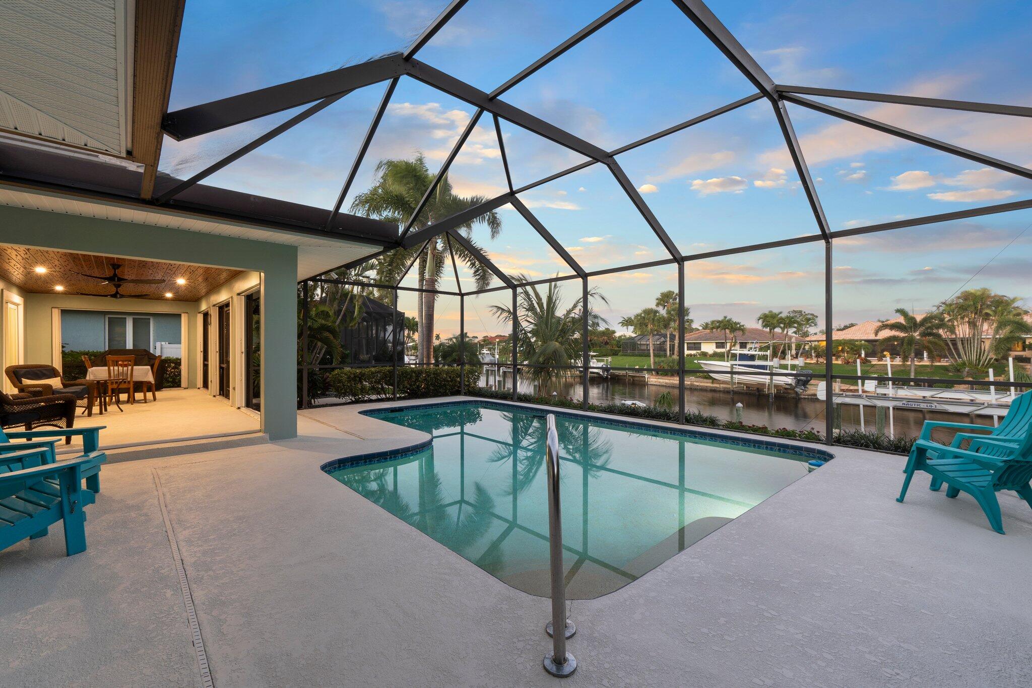 3142 Southeast Fairway West Stuart, FL 34997 - Photo 30 of 38 a view of a swimming pool with a porch