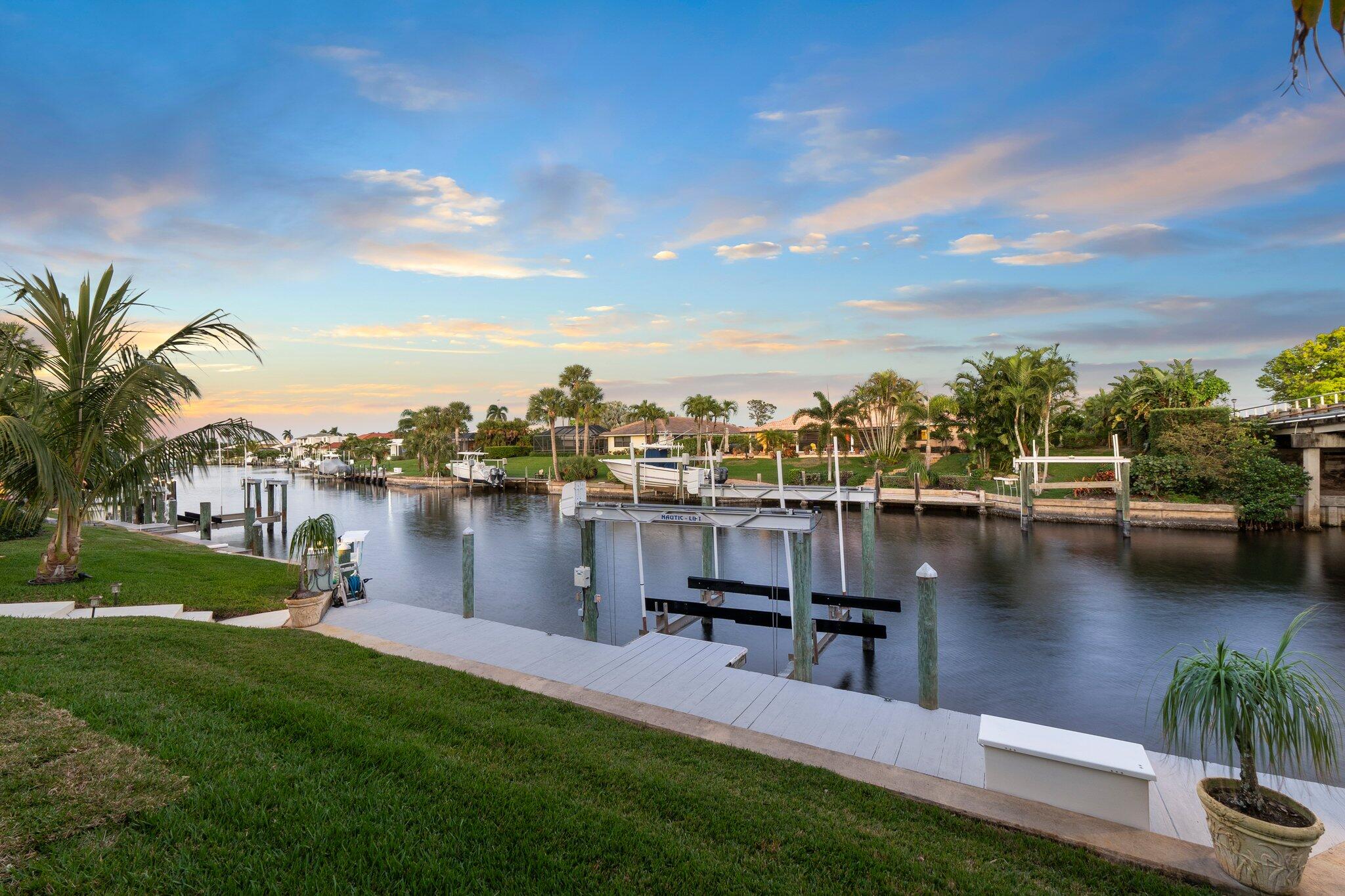 3142 Southeast Fairway West Stuart, FL 34997 - Photo 32 of 38 a view of a lake with couches and city view