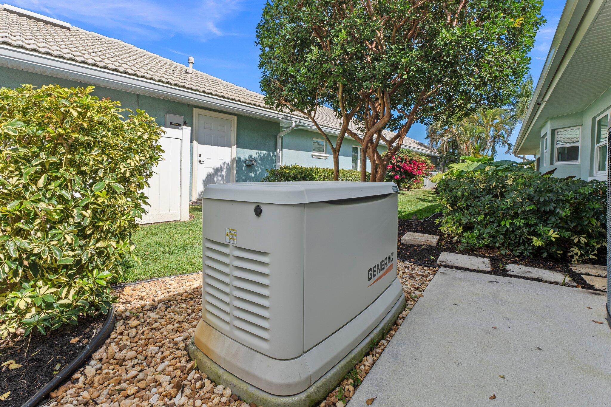 3142 Southeast Fairway West Stuart, FL 34997 - Photo 33 of 38 a view of a house with a yard and potted plants