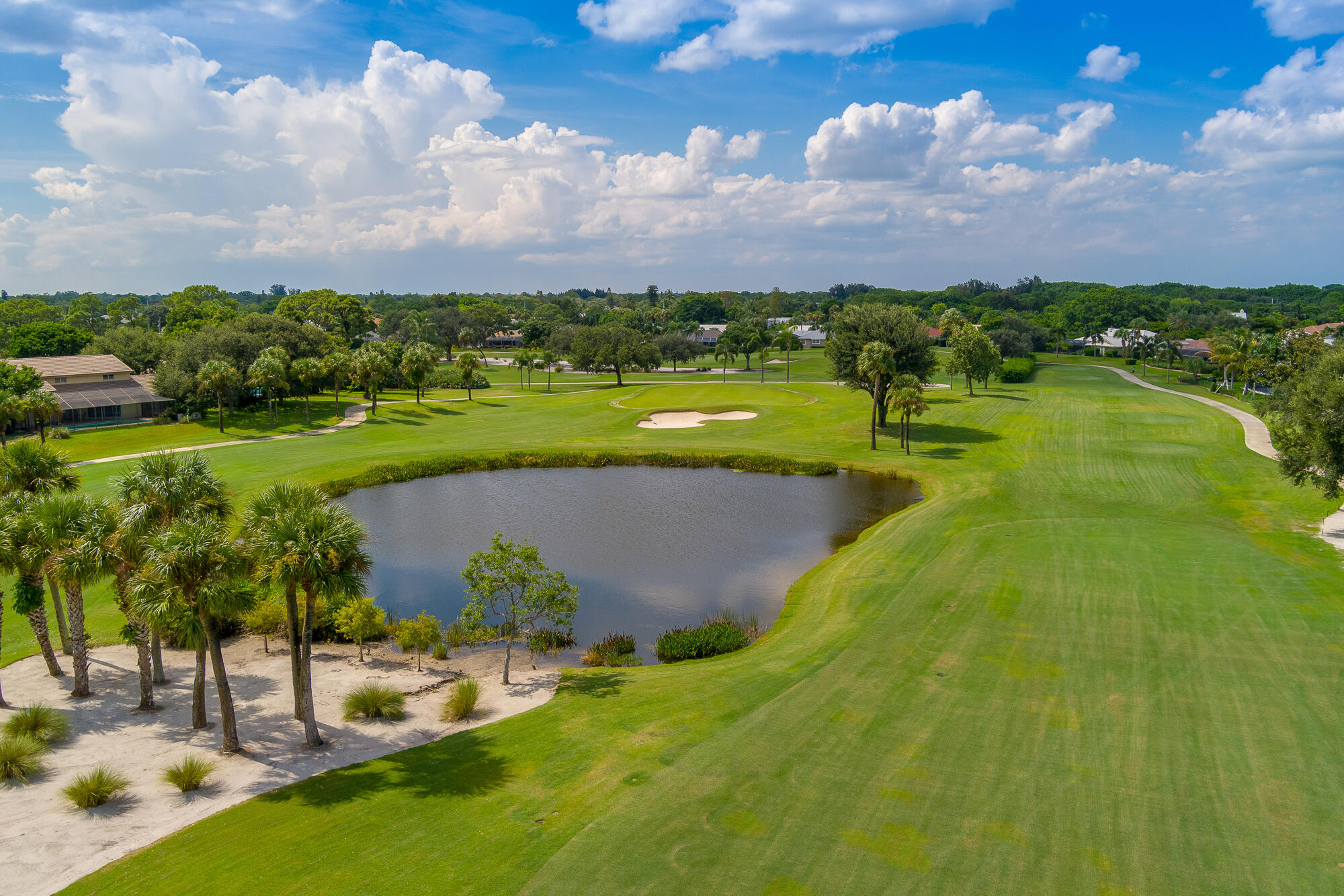 3142 Southeast Fairway West Stuart, FL 34997 - Photo 38 of 38 a view of a lake with a building in the background