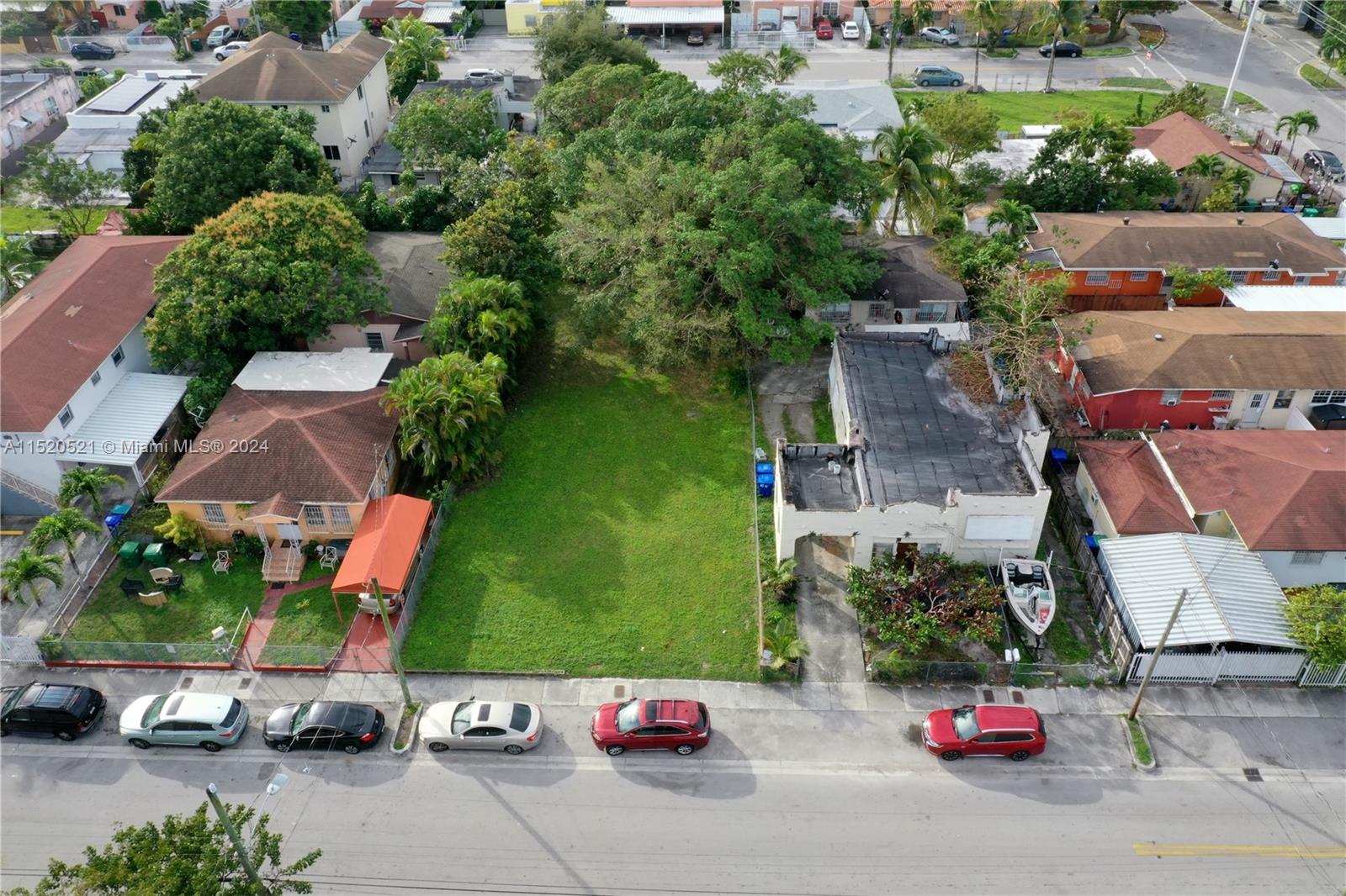 an aerial view of a house with a parking lot