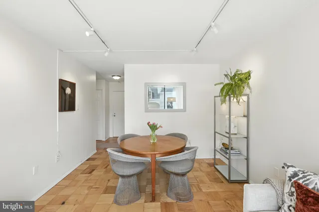 a bathroom with a sink toilet and a mirror
