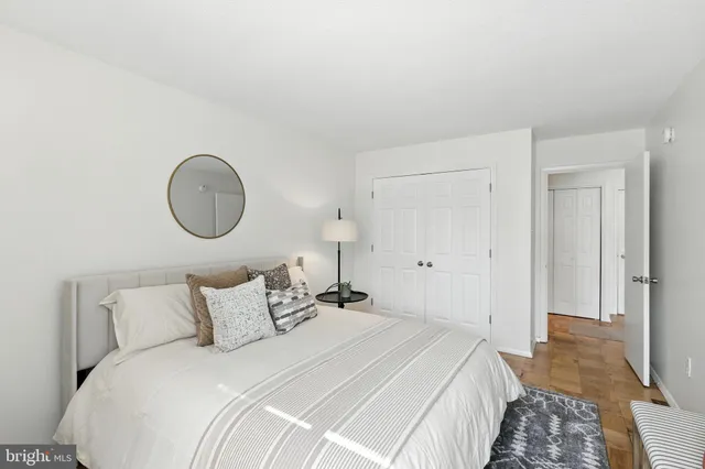 a bedroom with bed and a window