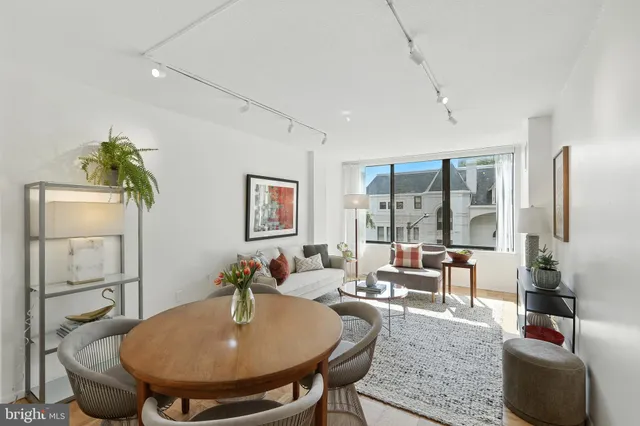 a living room with furniture and a table
