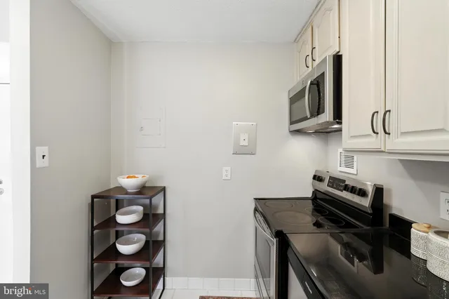 a kitchen with a sink cabinets and appliances