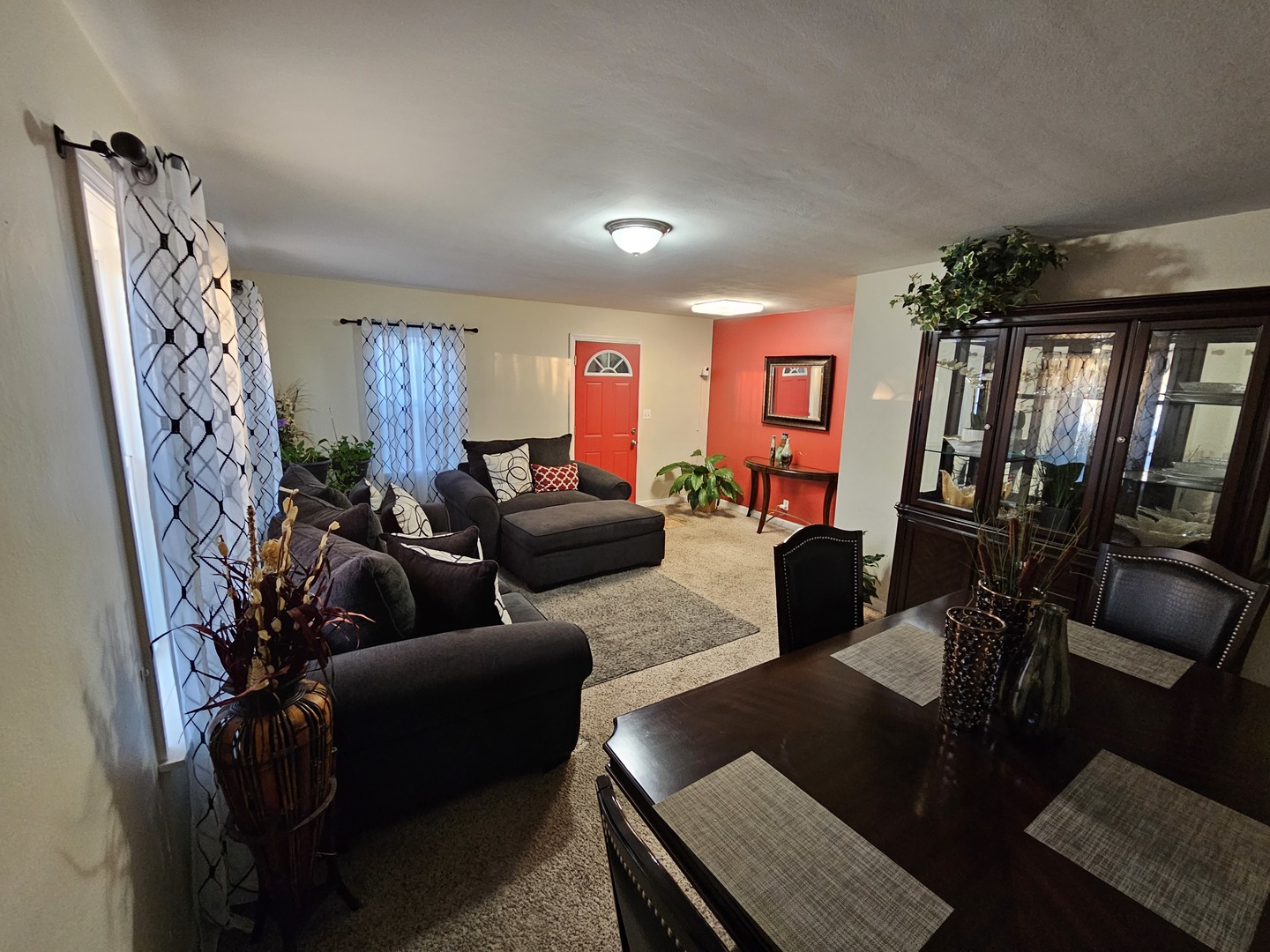 239 South McLean Boulevard Elgin, IL 60123 - Photo 11 of 30 a living room with furniture and a chandelier