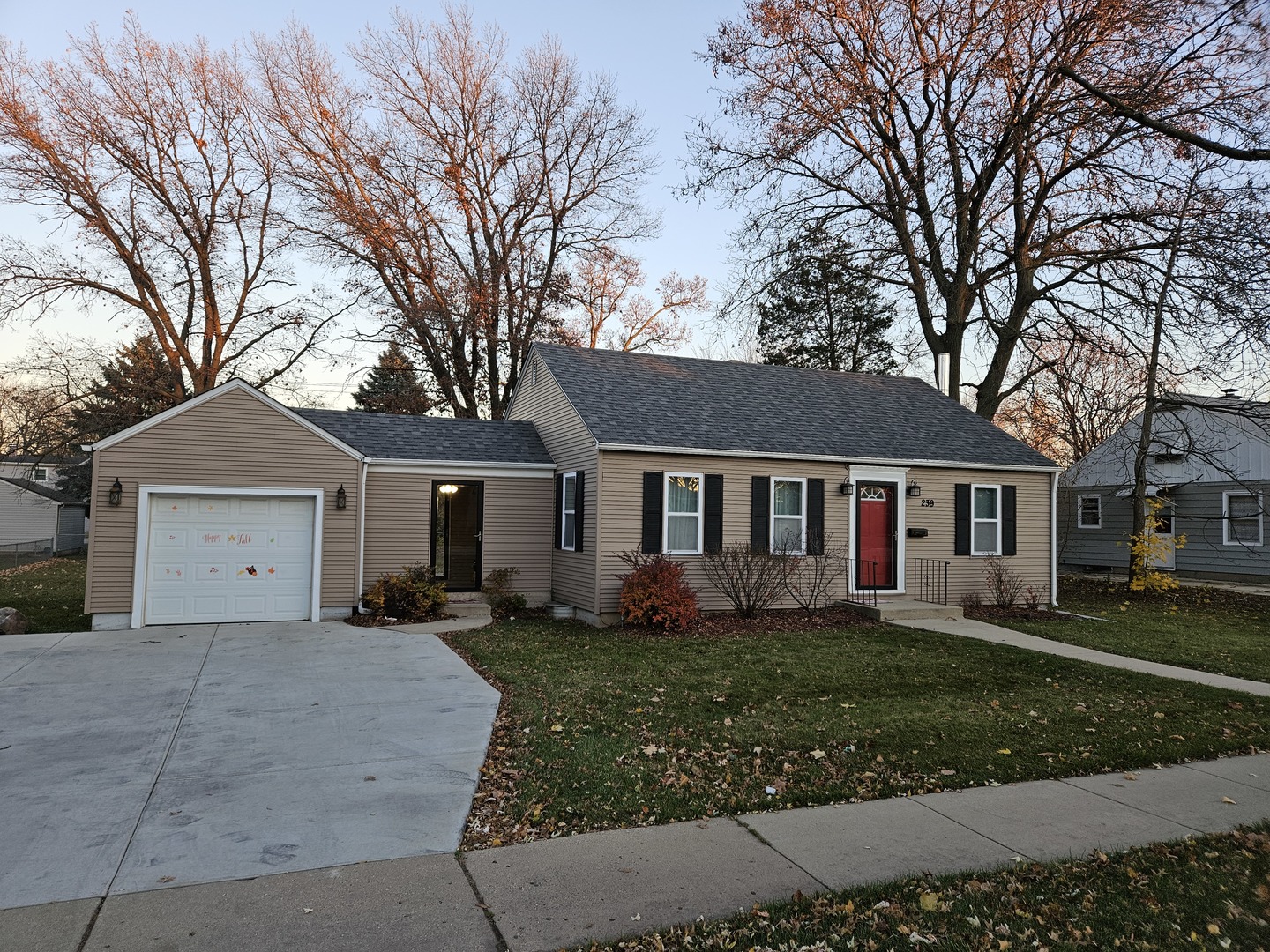239 South McLean Boulevard Elgin, IL 60123 - Photo 2 of 30 a front view of a house with a yard and trees