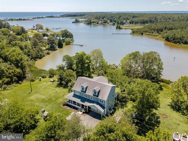 an aerial view of a house with a lake view