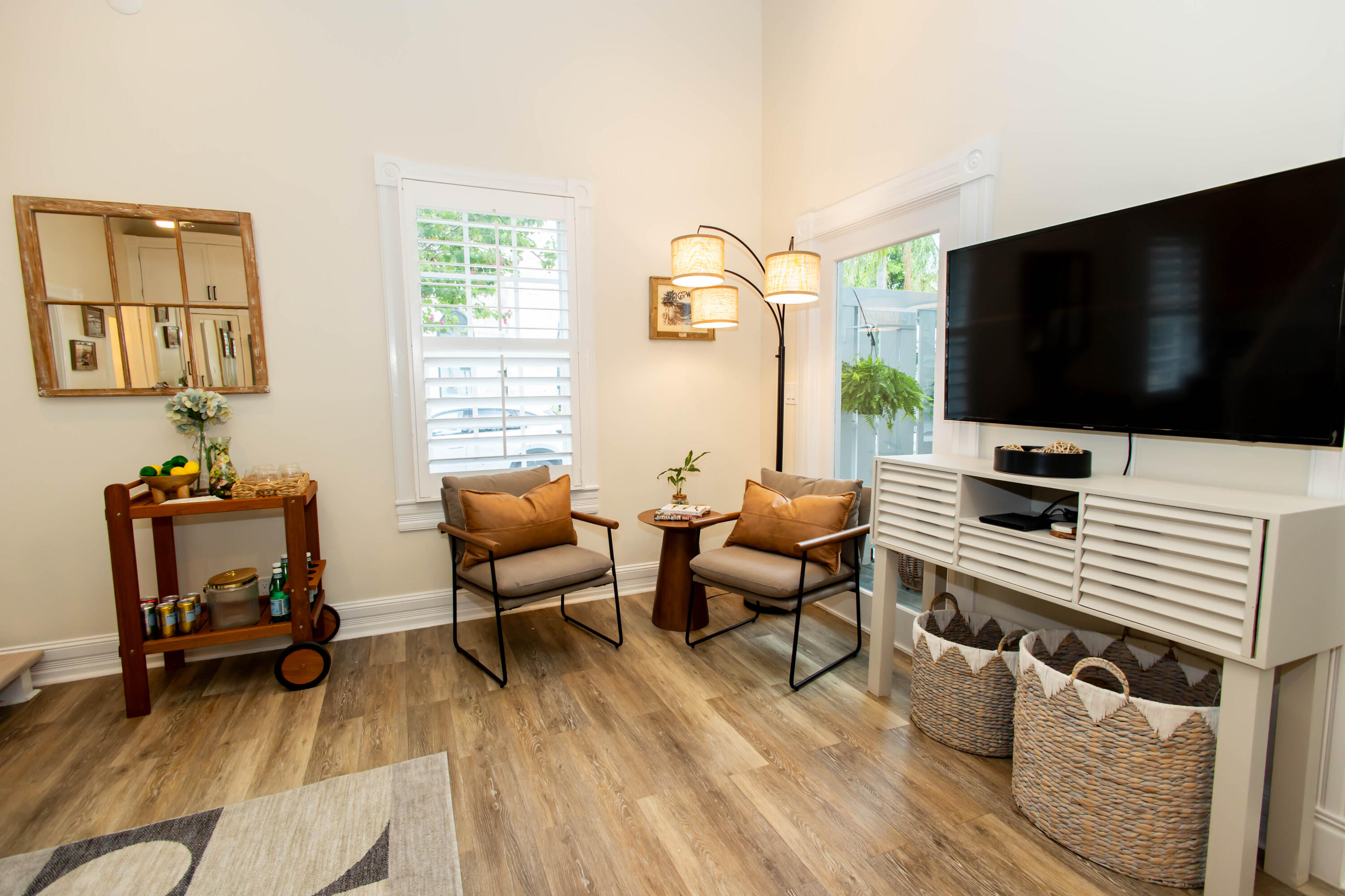 1012 Whitehead Street Key West, FL 33040 - Photo 17 of 49 a living room with furniture and a flat screen tv