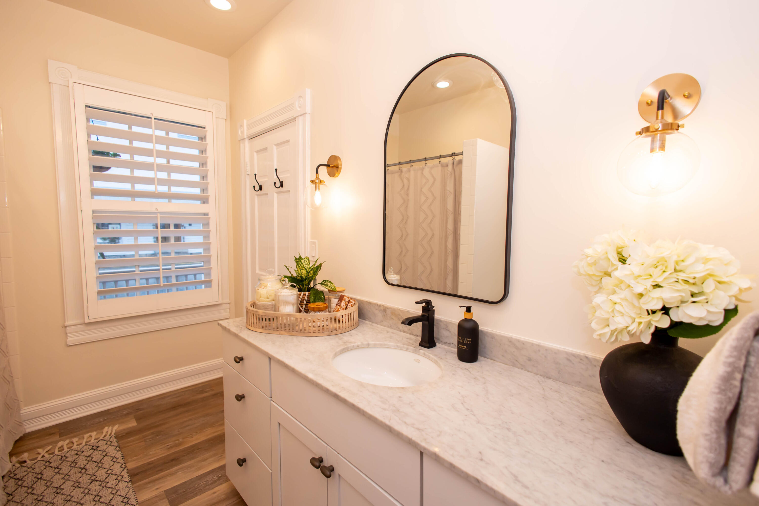 1012 Whitehead Street Key West, FL 33040 - Photo 19 of 49 a bathroom with a double vanity sink and a window