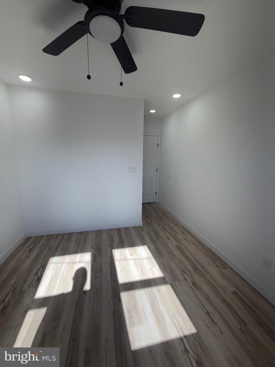 1924 68th Avenue Philadelphia, PA 19138 - Photo 12 of 12 an empty room with wooden floor and windows