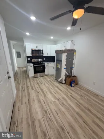 a view of a room with furniture and a wooden floor