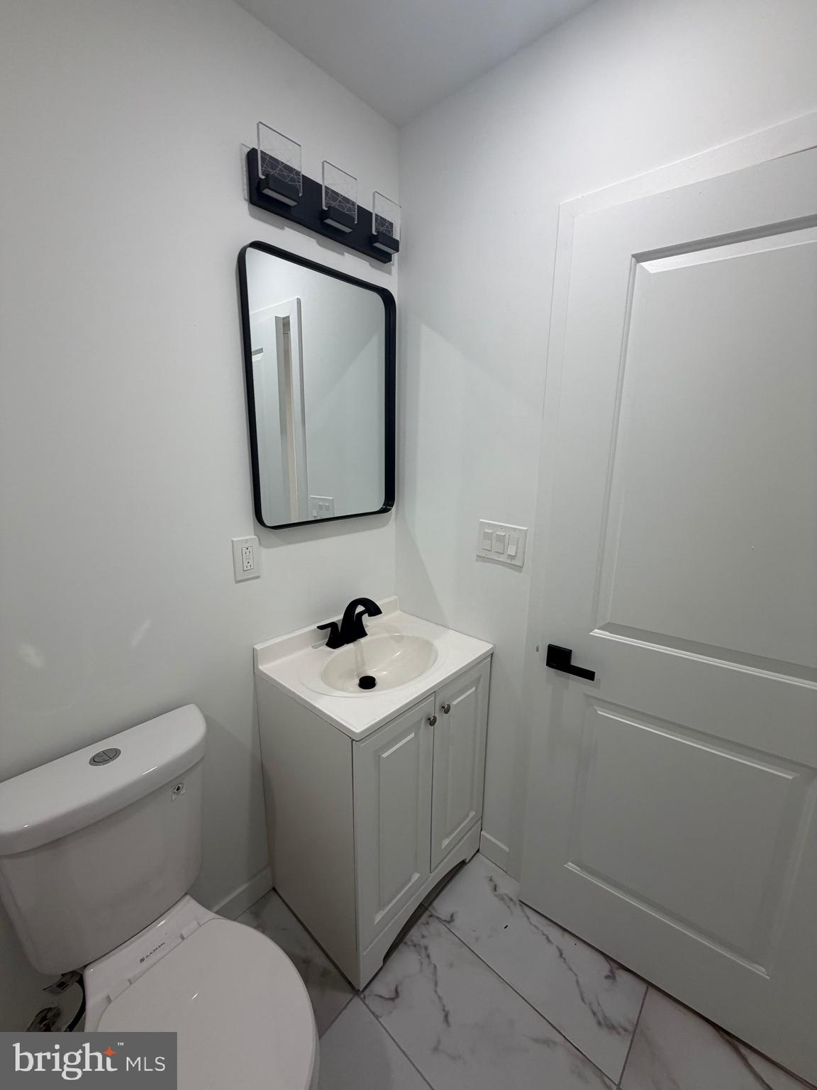 1924 68th Avenue Philadelphia, PA 19138 - Photo 6 of 12 a bathroom with a toilet sink and mirror