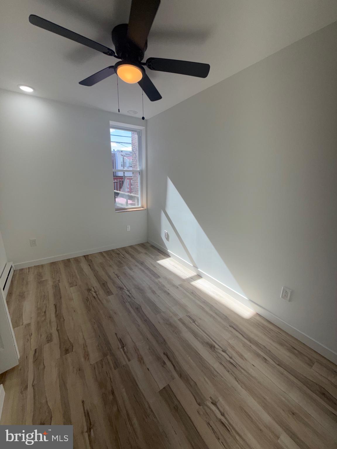 1924 68th Avenue Philadelphia, PA 19138 - Photo 7 of 12 a view of an empty room and window