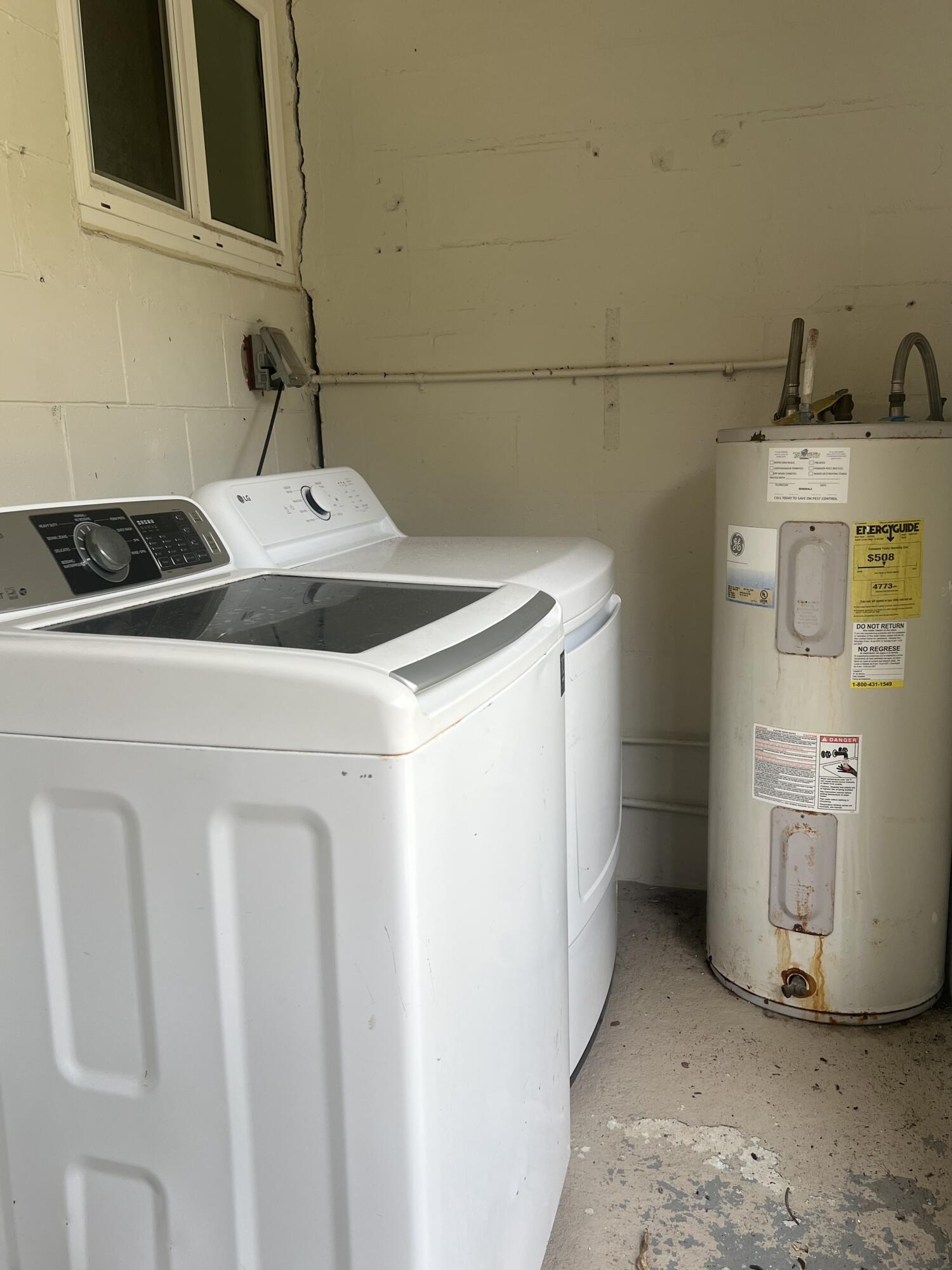 462 Granada Street, Unit A Fort Pierce, FL 34949 - Photo 9 of 10 a utility room with dryer and washer