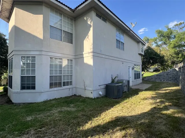 a view of a backyard with potted plants