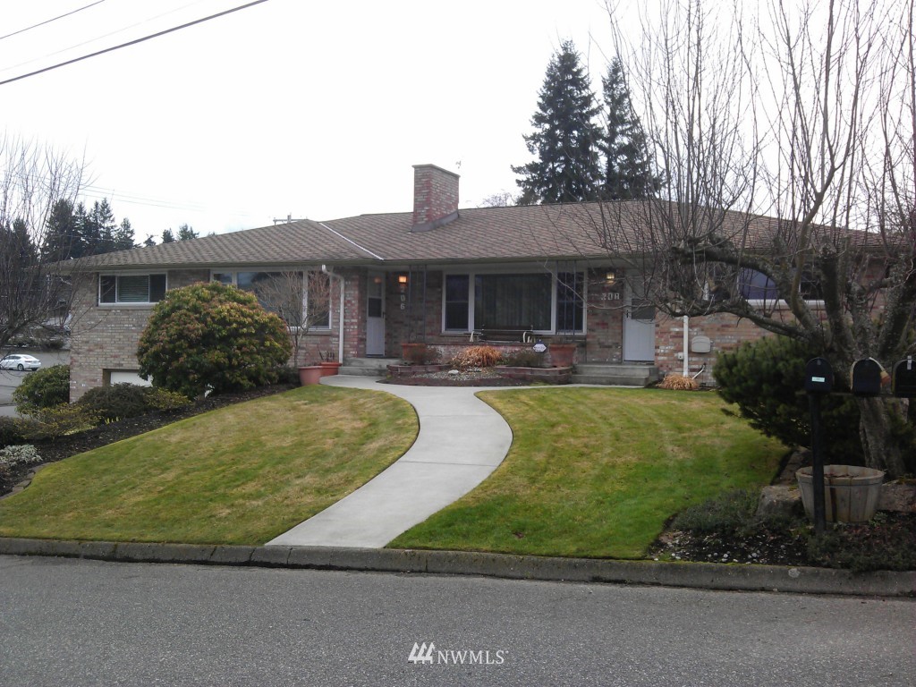 206 Heather Road, Unit 2 Everett, WA 98203 - Photo 1 of 12 a house view with swimming pool and outdoor space