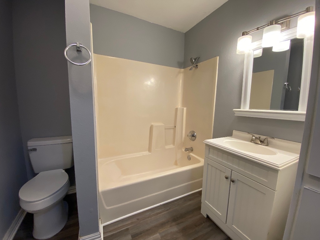 6211 Chesterfield Avenue, Unit B Austin, TX 78752 - Photo 16 of 24 a bathroom with a sink toilet and shower