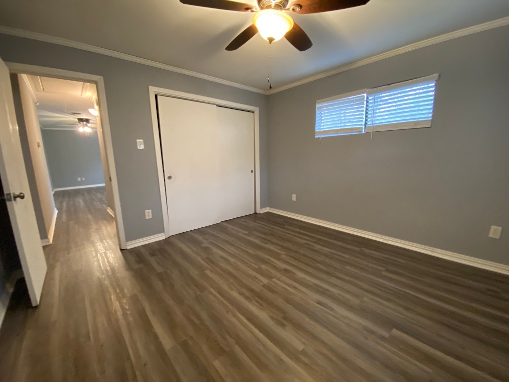6211 Chesterfield Avenue, Unit B Austin, TX 78752 - Photo 19 of 24 wooden floor in an empty room with a window