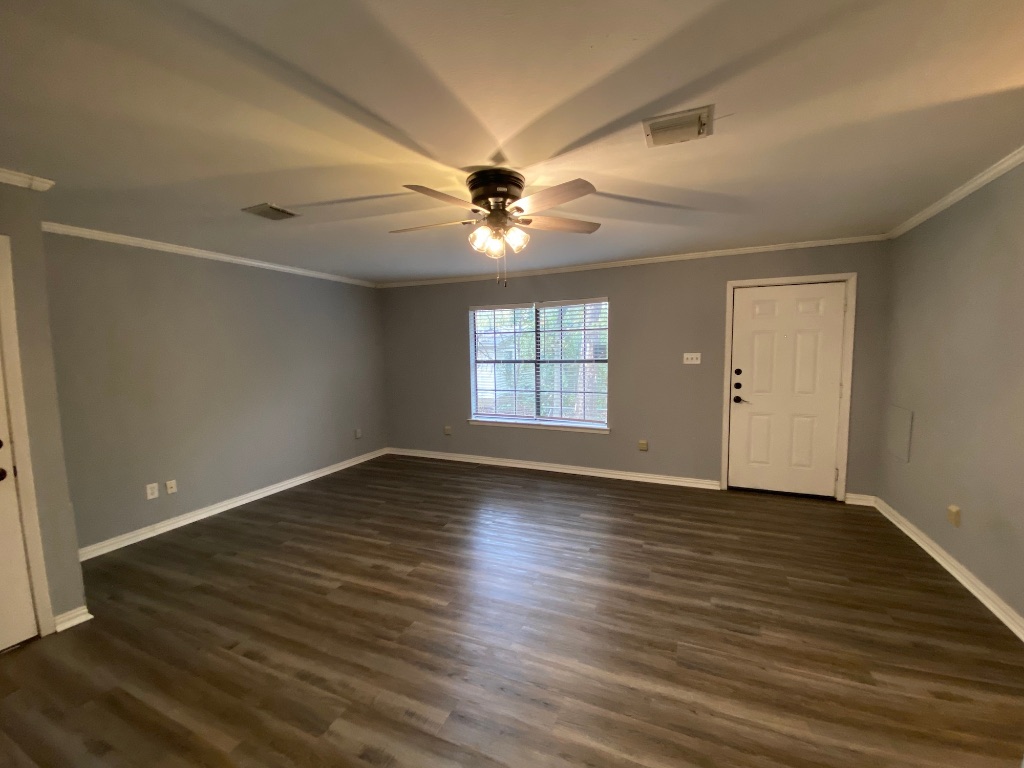 6211 Chesterfield Avenue, Unit B Austin, TX 78752 - Photo 4 of 24 wooden floor in an empty room with a window