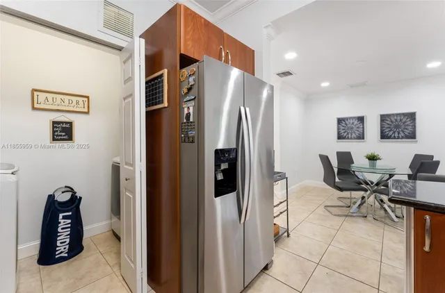 a kitchen with stainless steel appliances granite countertop a sink stove and microwave