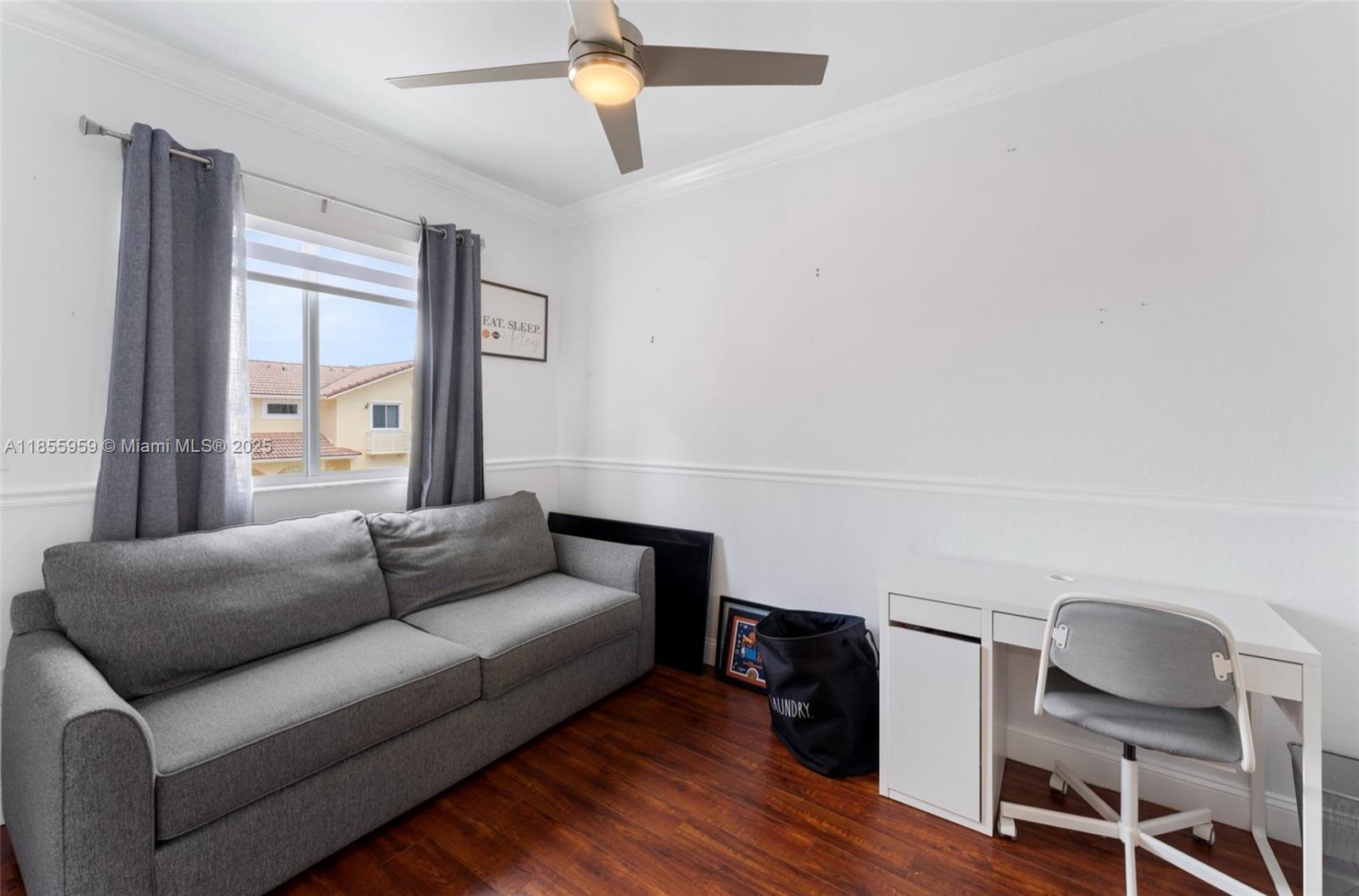 7423 Northwest 182nd Street Hialeah, FL 33015 - Photo 18 of 29 a living room with furniture and a window