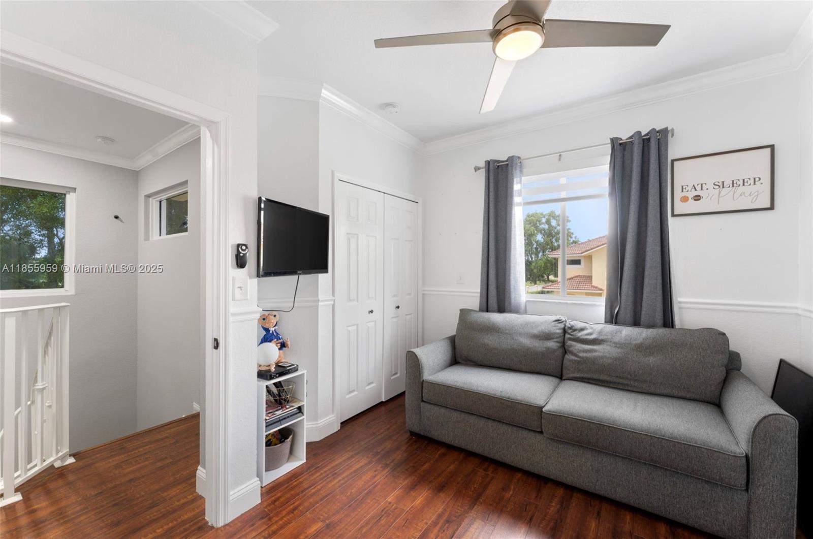 7423 Northwest 182nd Street Hialeah, FL 33015 - Photo 19 of 29 a living room with furniture and a flat screen tv