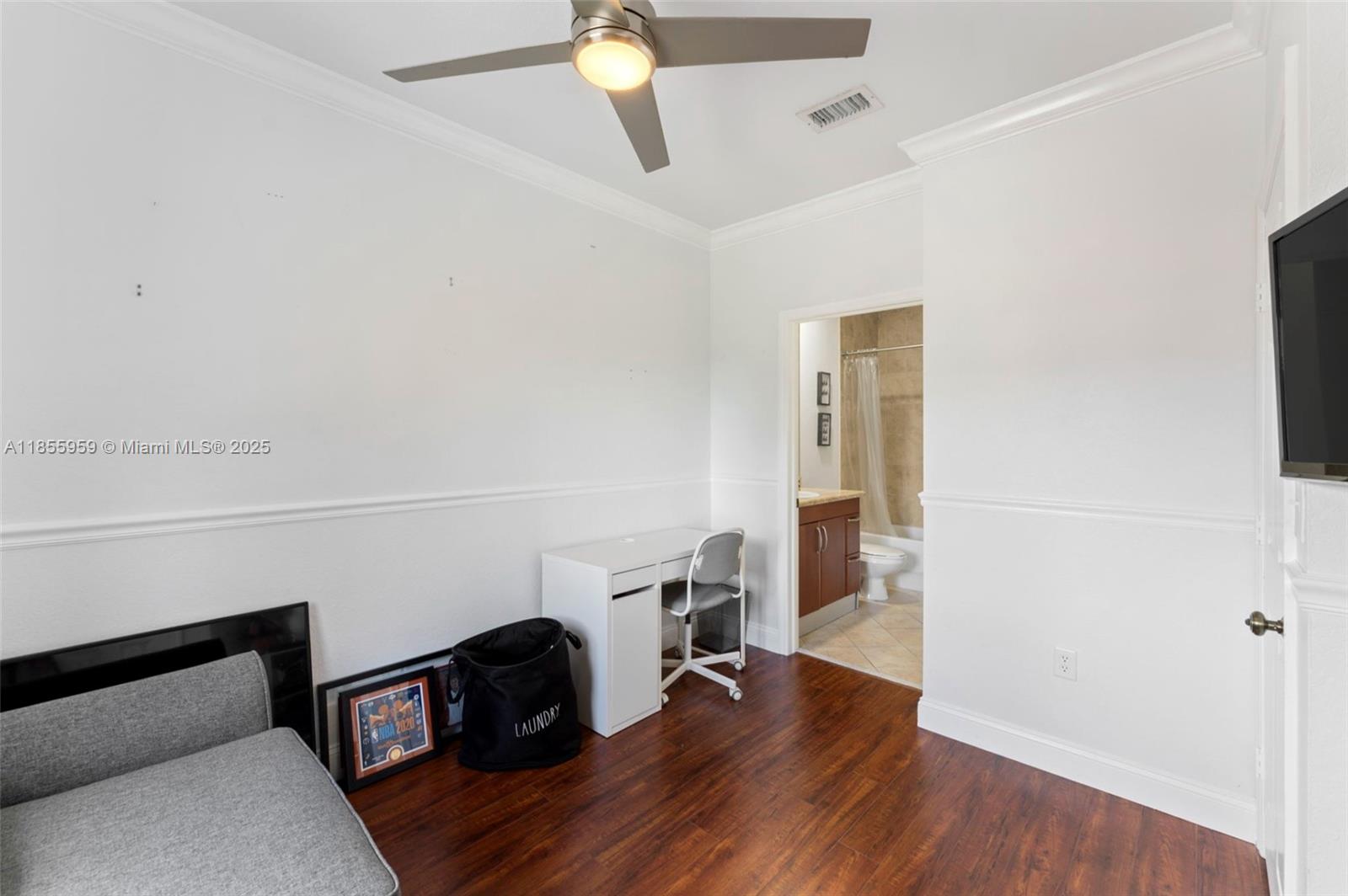 7423 Northwest 182nd Street Hialeah, FL 33015 - Photo 20 of 29 a view of a workspace with furniture and wooden floor