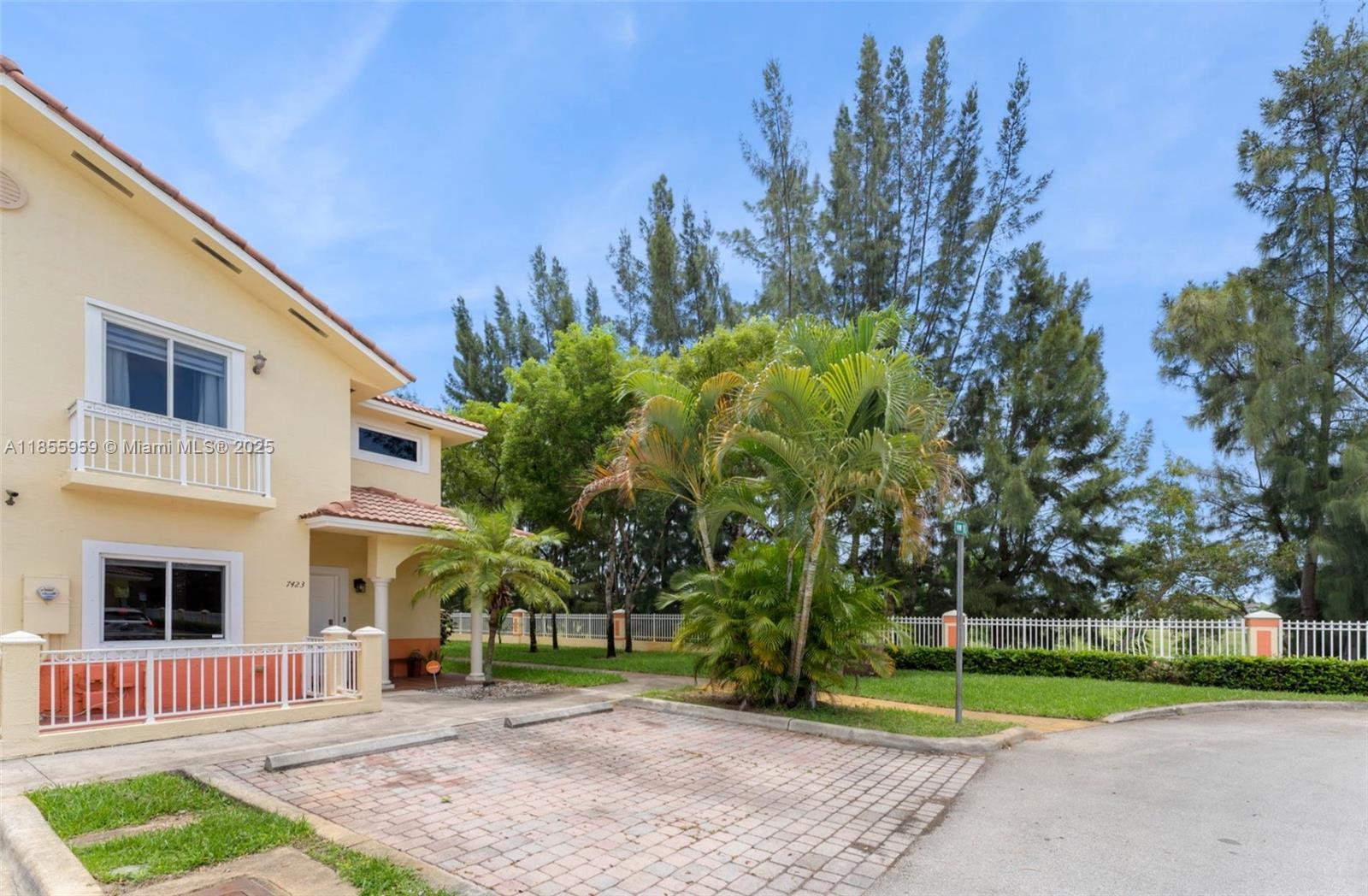 7423 Northwest 182nd Street Hialeah, FL 33015 - Photo 2 of 29 a front view of a house with garden