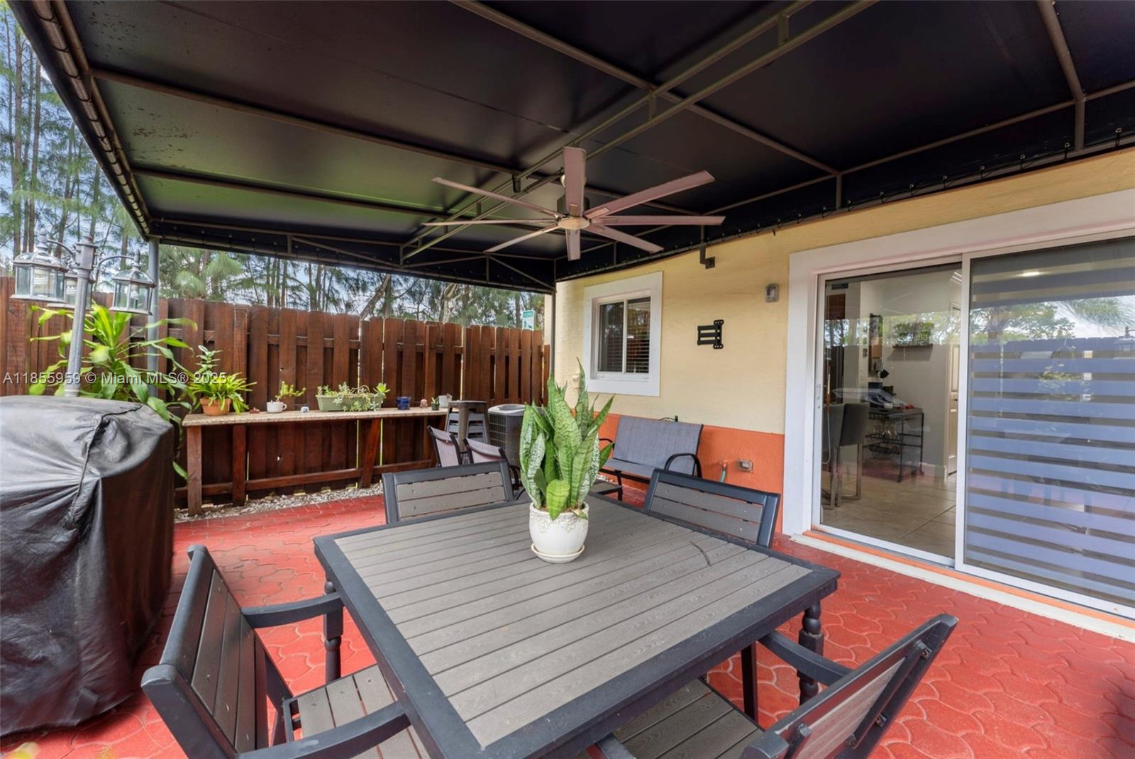 7423 Northwest 182nd Street Hialeah, FL 33015 - Photo 26 of 29 a view of a chairs and table in a patio