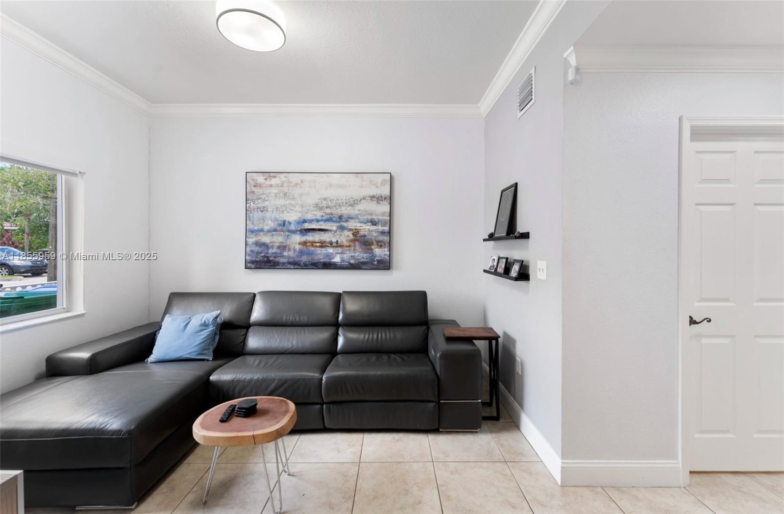 7423 Northwest 182nd Street Hialeah, FL 33015 - Photo 4 of 29 a living room with furniture and a couch