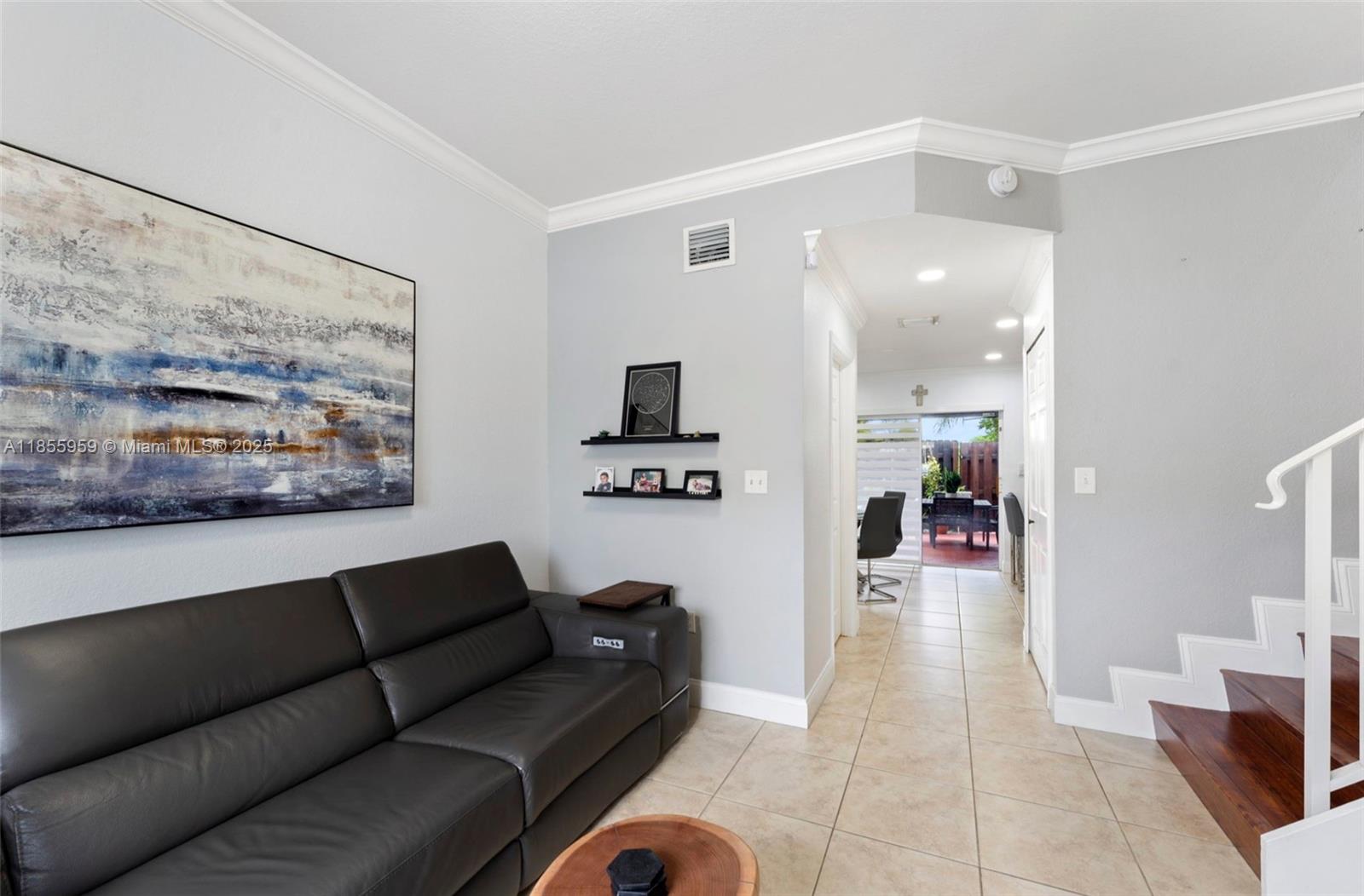 7423 Northwest 182nd Street Hialeah, FL 33015 - Photo 7 of 29 a living room with furniture and a view of kitchen