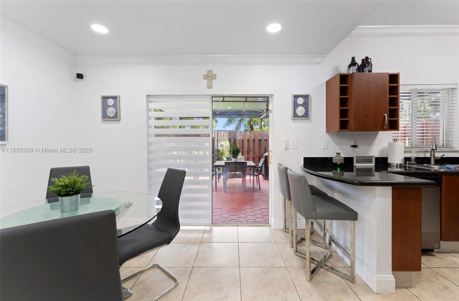 7423 Northwest 182nd Street Hialeah, FL 33015 - Photo 9 of 29 a living room with furniture a wooden floor and a sink