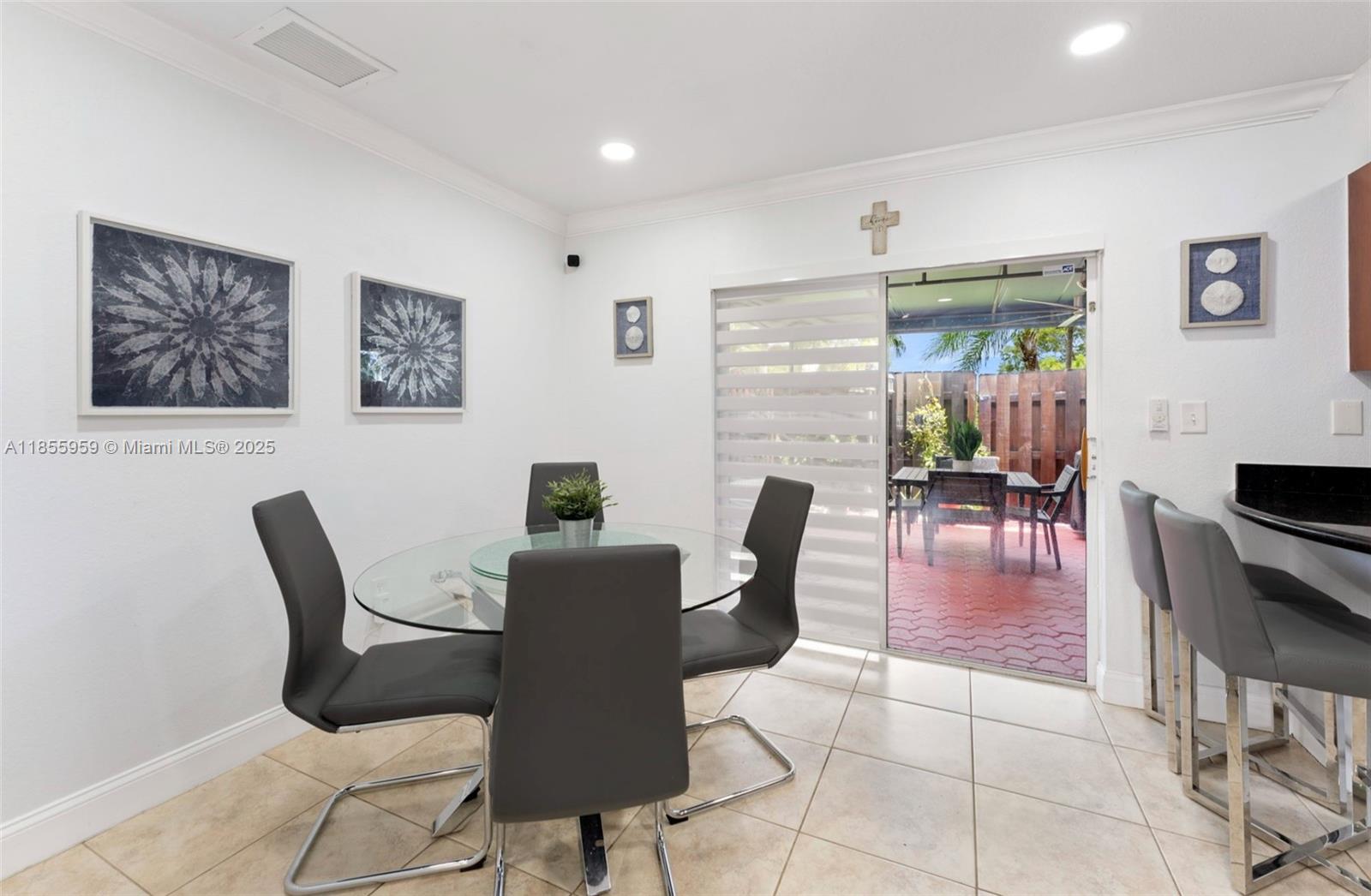 7423 Northwest 182nd Street Hialeah, FL 33015 - Photo 10 of 29 a dining room with furniture and wooden floor