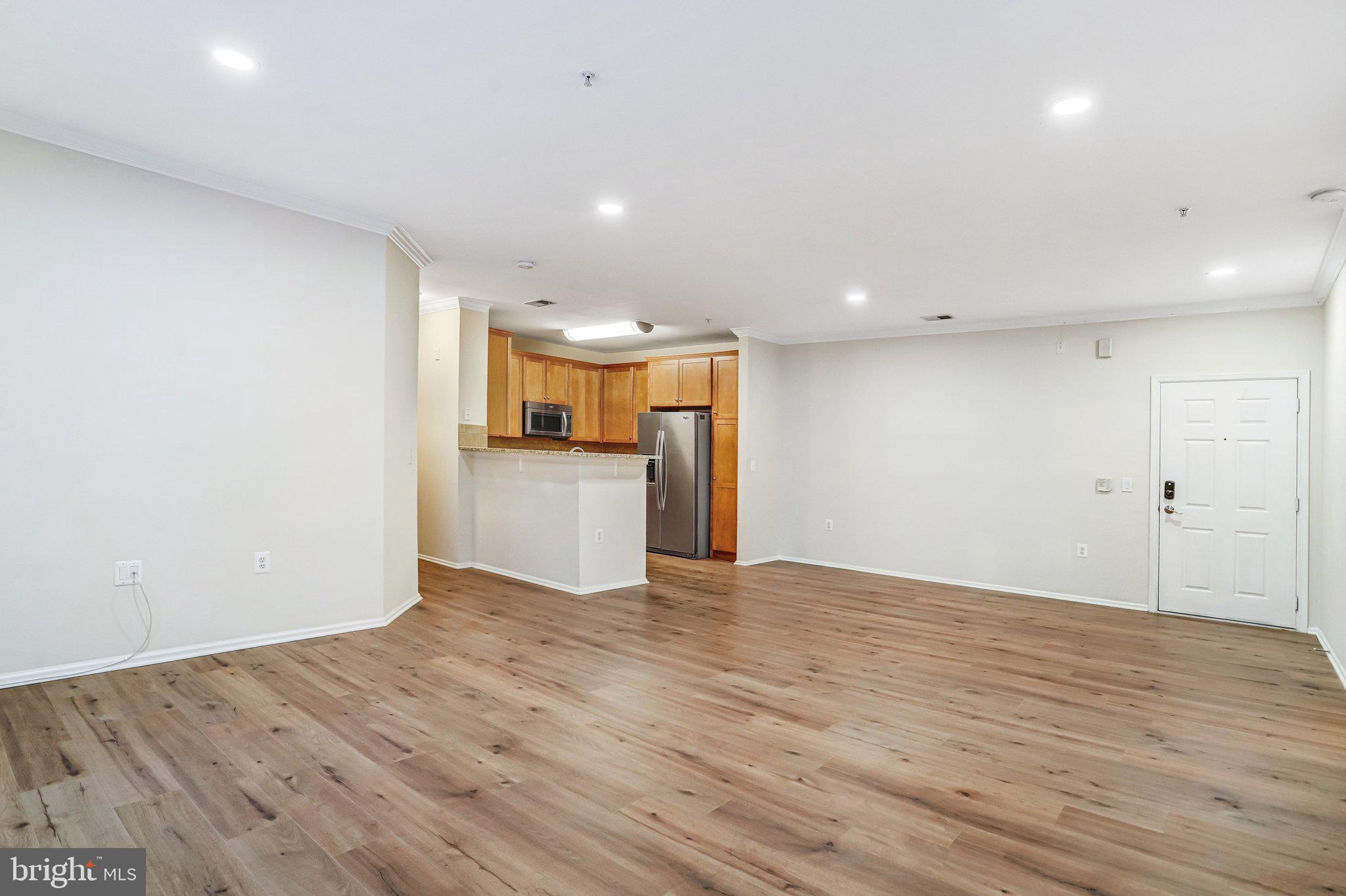 11800 Old Georgetown Road, Unit 1207 North Bethesda, MD 20852 - Photo 17 of 65 a view of a kitchen with a sink and a refrigerator