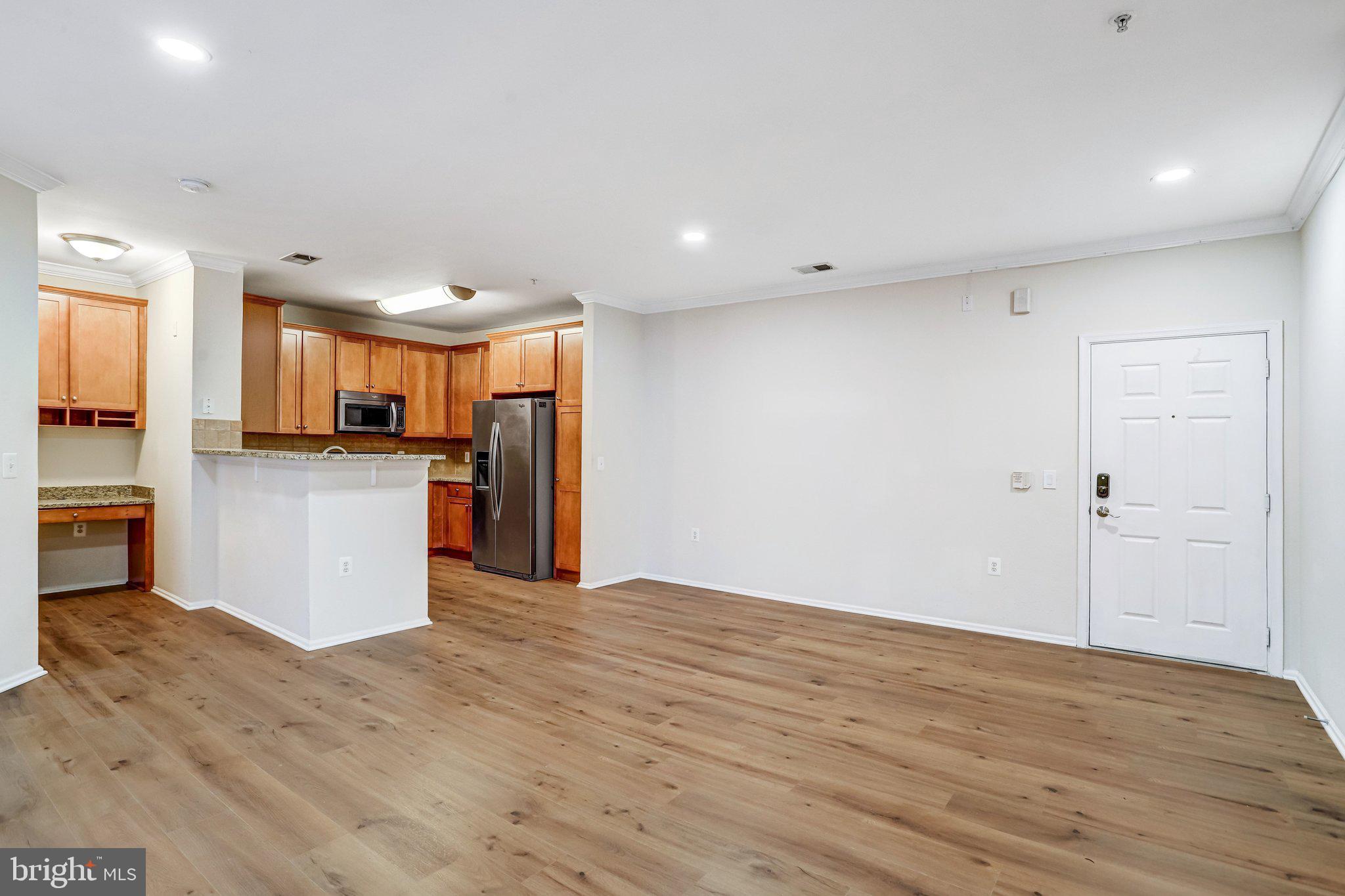 11800 Old Georgetown Road, Unit 1207 North Bethesda, MD 20852 - Photo 24 of 65 a view of a kitchen with a refrigerator and a stove top oven