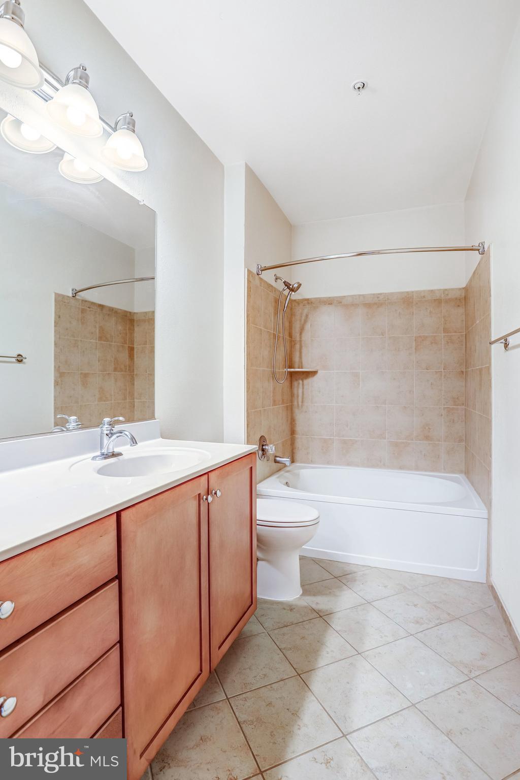11800 Old Georgetown Road, Unit 1207 North Bethesda, MD 20852 - Photo 30 of 65 a bathroom with a sink a toilet and bathtub