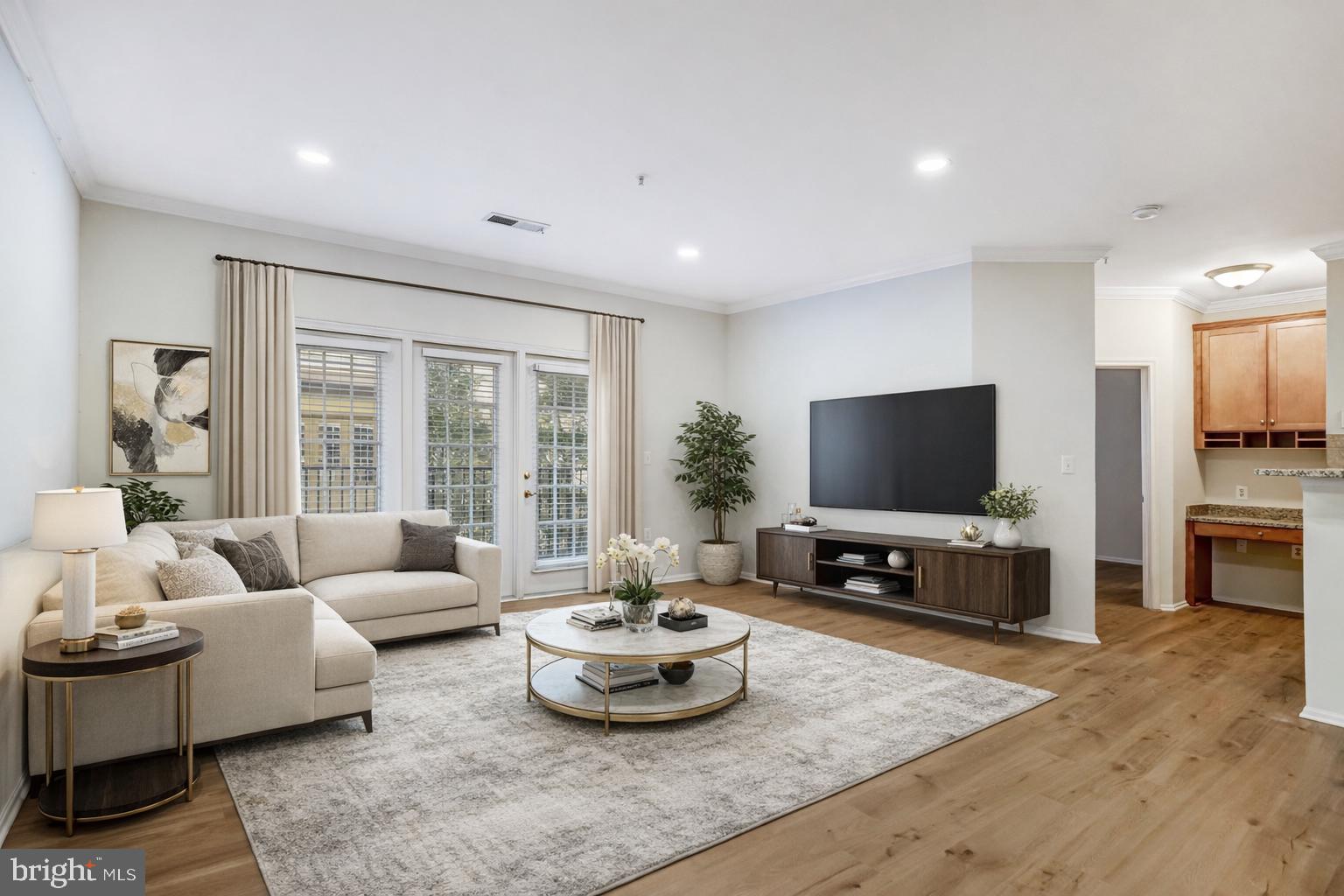 11800 Old Georgetown Road, Unit 1207 North Bethesda, MD 20852 - Photo 3 of 65 a living room with furniture and a flat screen tv