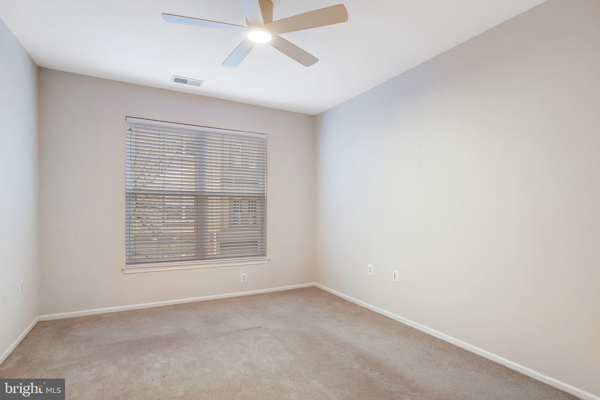 11800 Old Georgetown Road, Unit 1207 North Bethesda, MD 20852 - Photo 33 of 65 an empty room with a empty space and windows