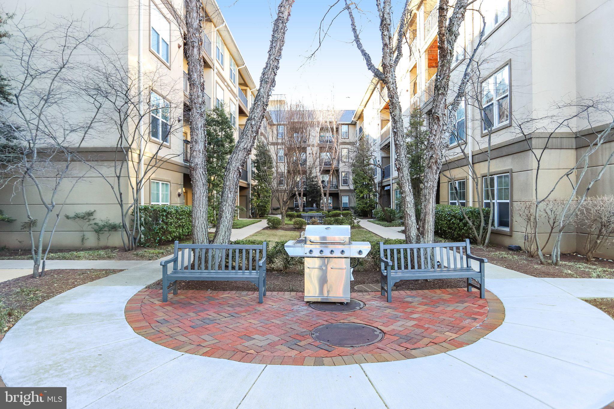 11800 Old Georgetown Road, Unit 1207 North Bethesda, MD 20852 - Photo 44 of 65 a view of a chair and tables in the patio