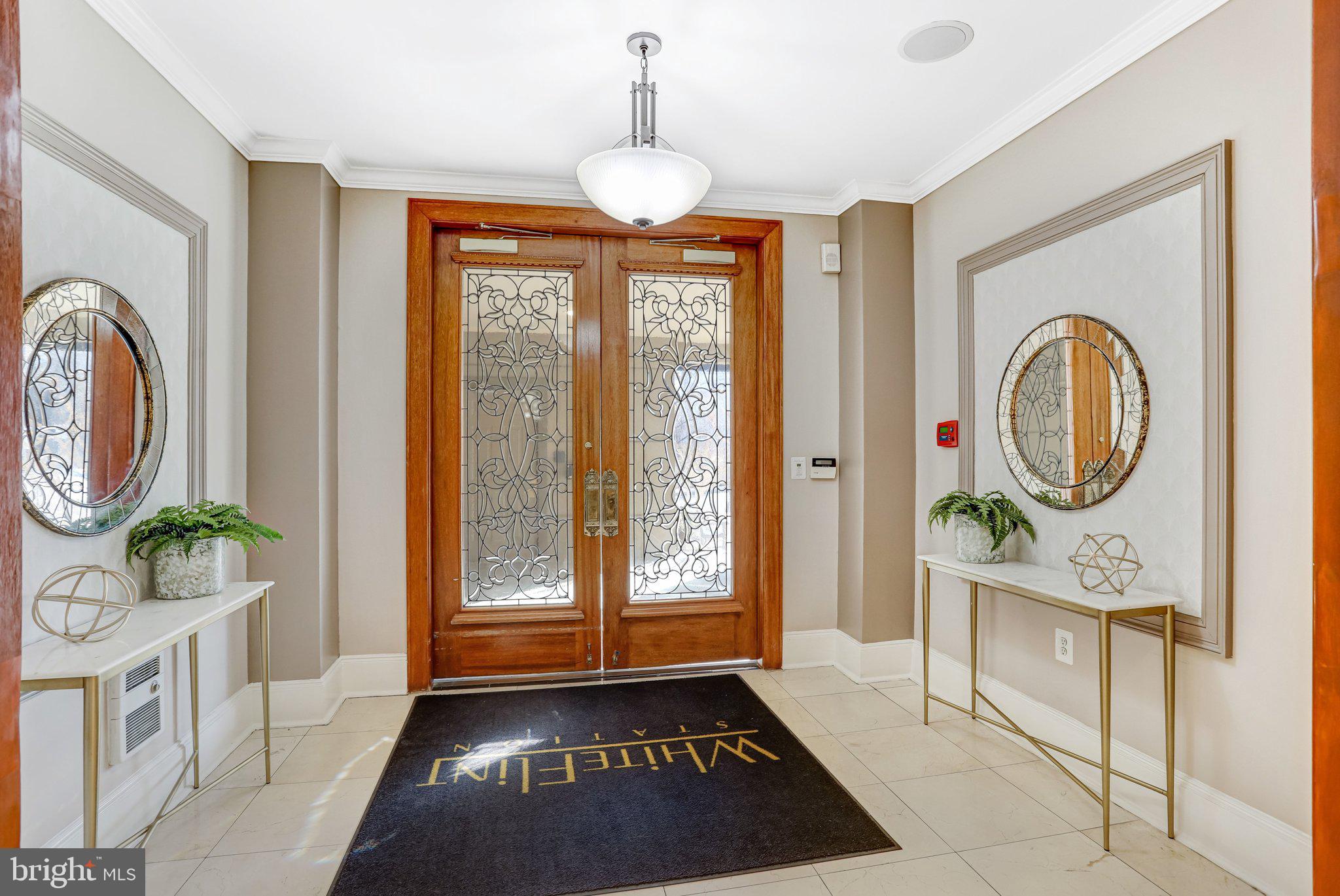 11800 Old Georgetown Road, Unit 1207 North Bethesda, MD 20852 - Photo 50 of 65 a hallway with painting on the wall and a window